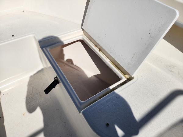 Open storage compartment on 2023 May-Craft 208 CC boat.