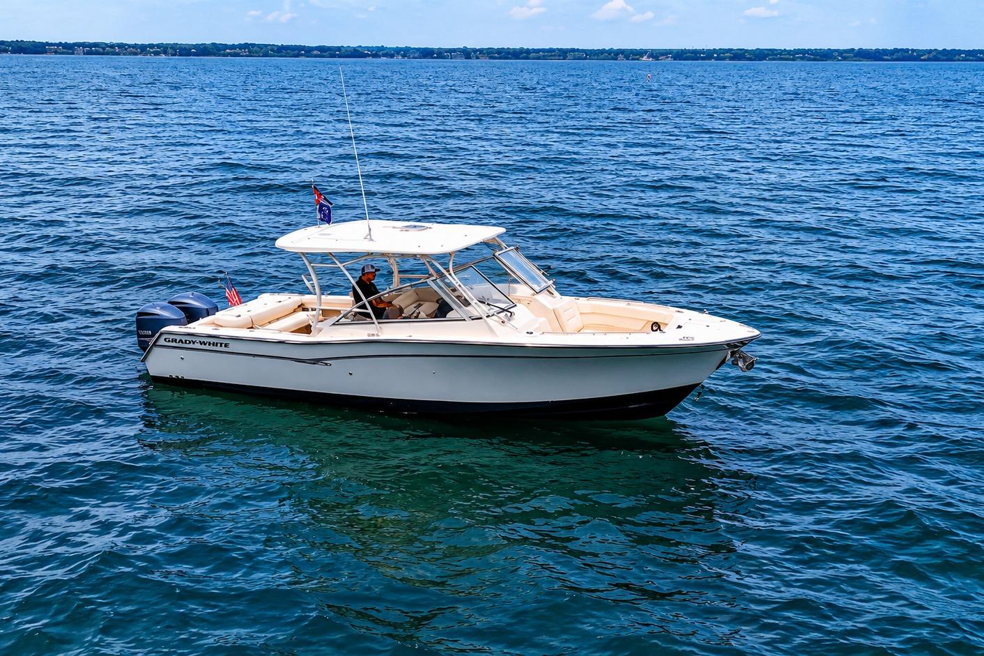 2019 Grady-White Freedom 307 boat cruising on open water under clear skies.