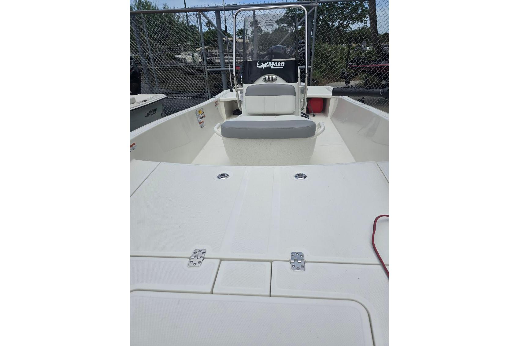 2026 Mako Pro Skiff 15 CC boat interior with seating and storage compartments.