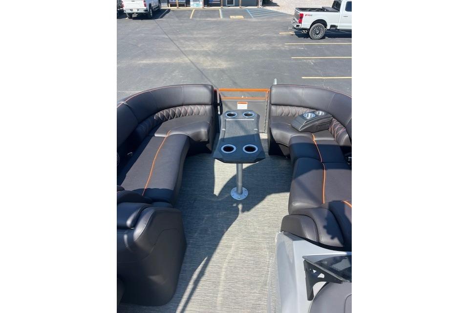 2024 Bennington 23 RXFBA boat interior with luxurious seating and cup holders.