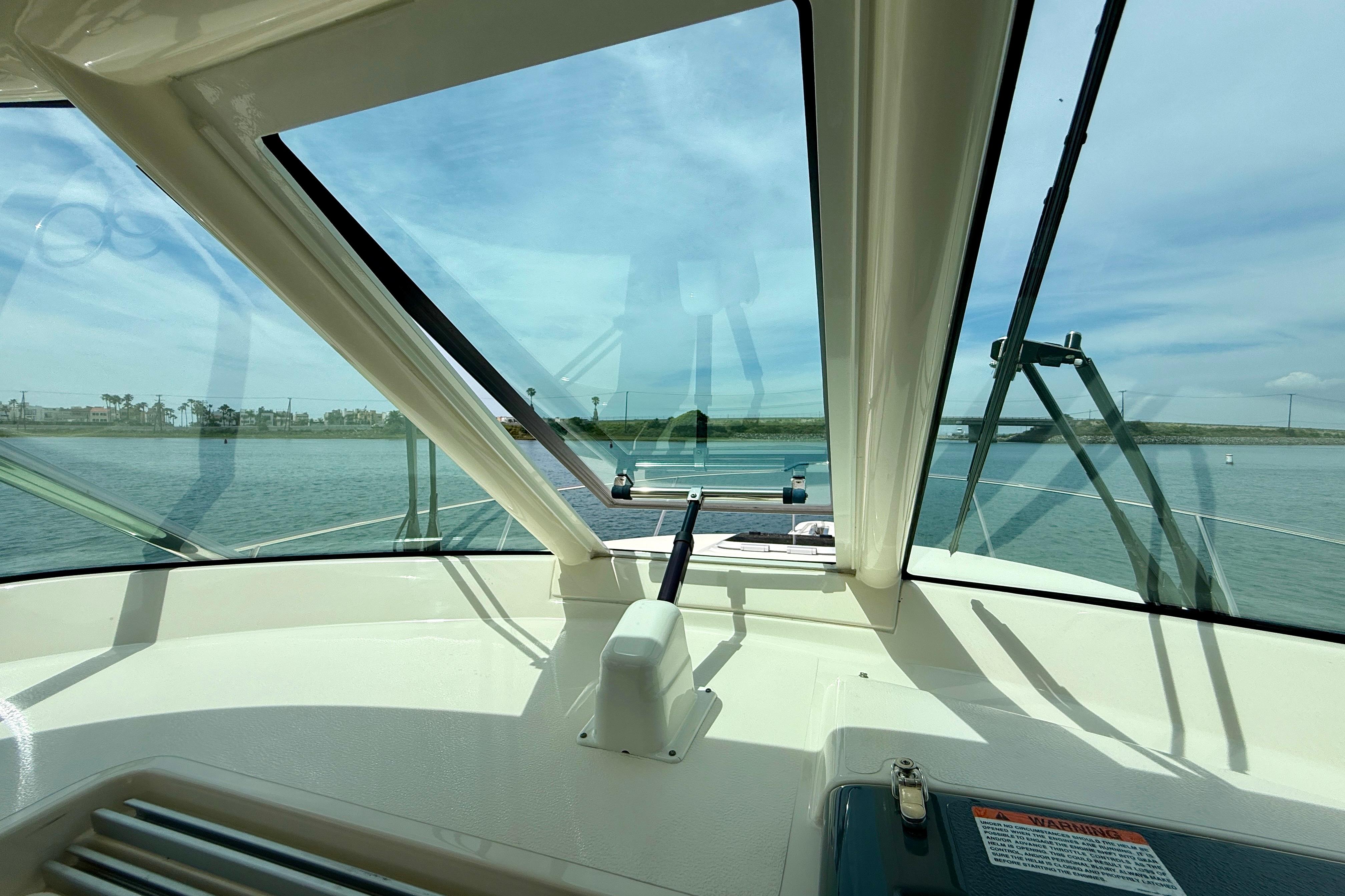 2012 Pursuit OS 345 Offshore boat interior with clear view of water and sky.