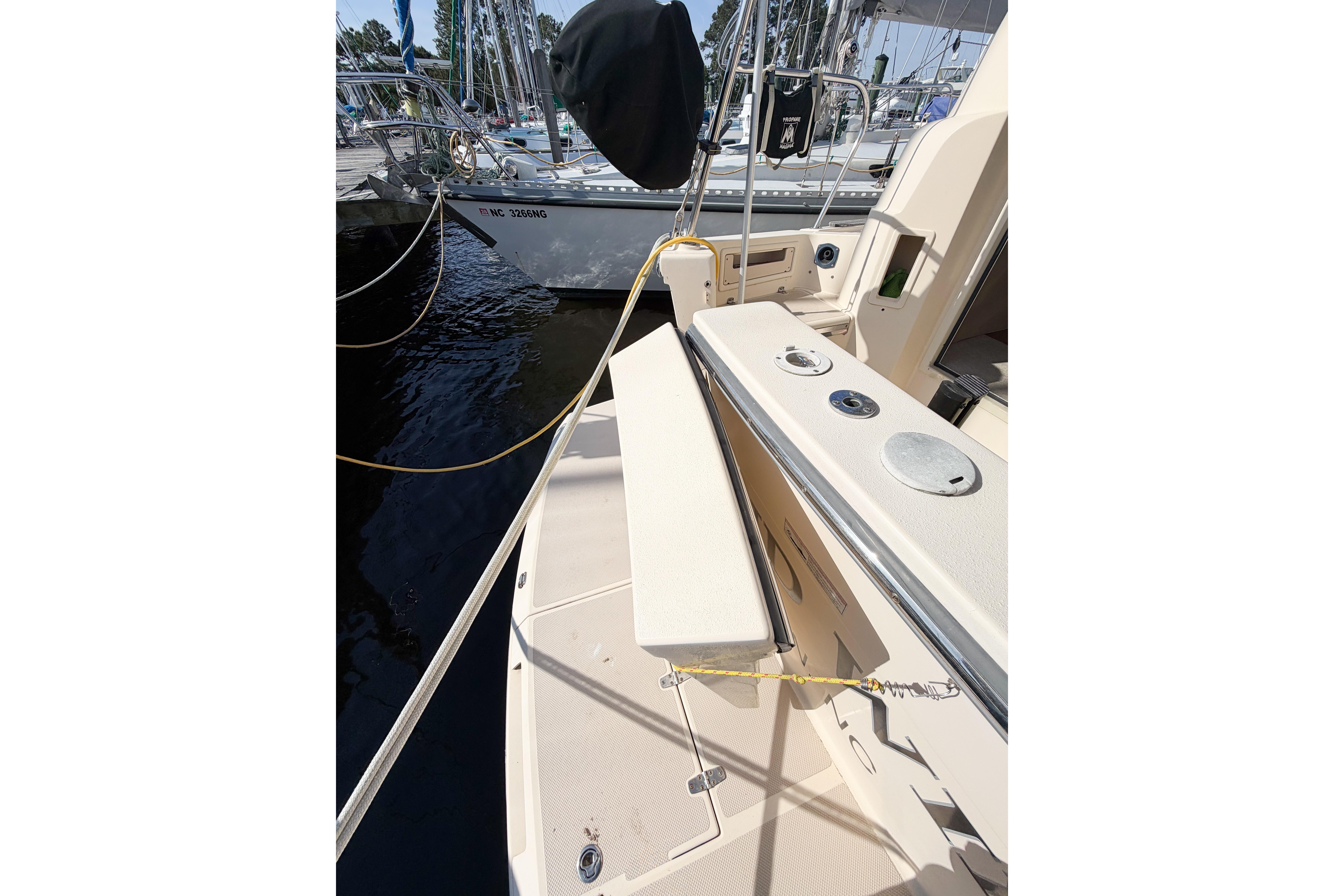 2007 Island Packet SP Cruiser deck view with docked sailboats in marina.