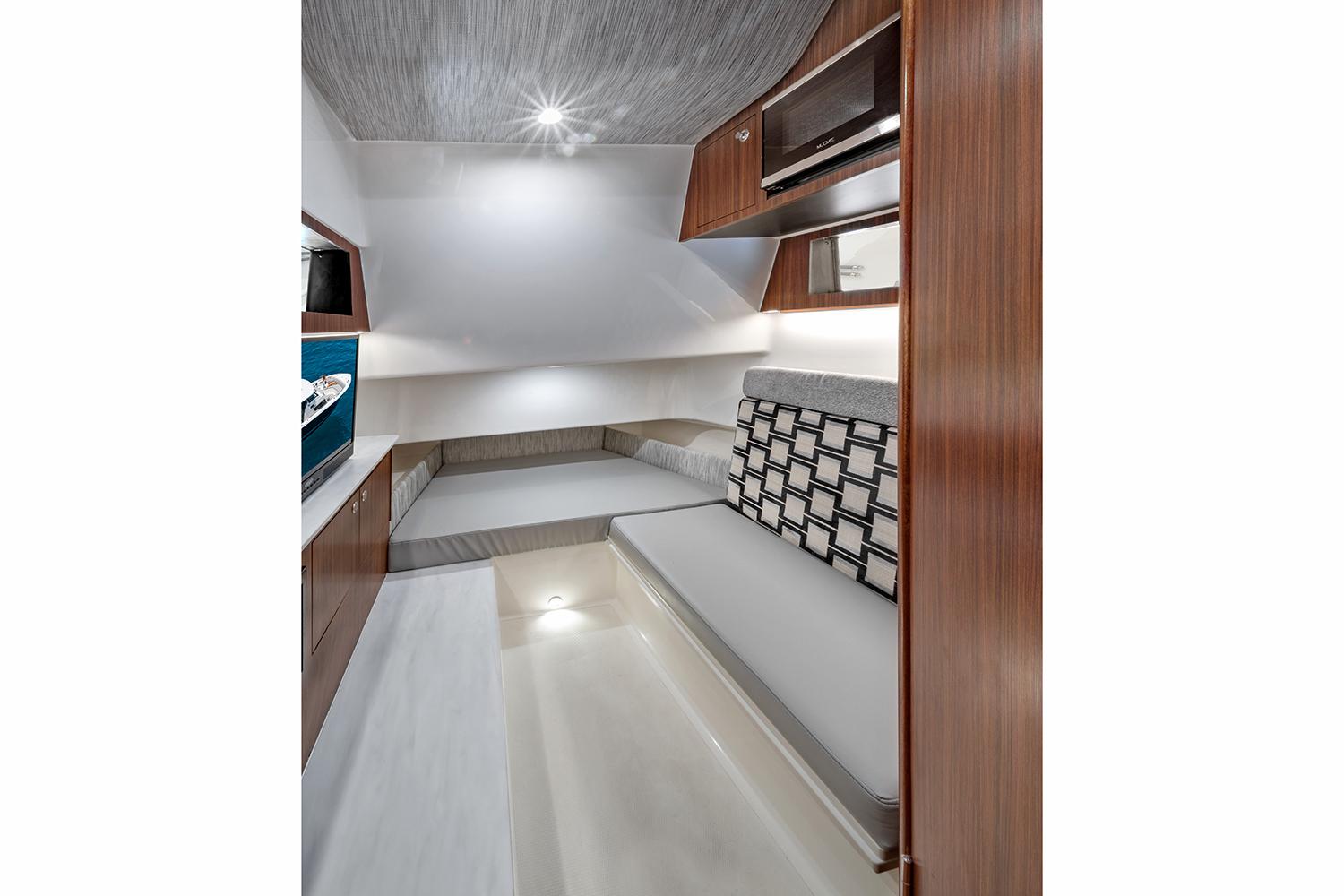 Manufacturer Provided Image: Interior cabin of 2025 Pursuit S 358 Sport boat, featuring modern design and comfortable seating.
