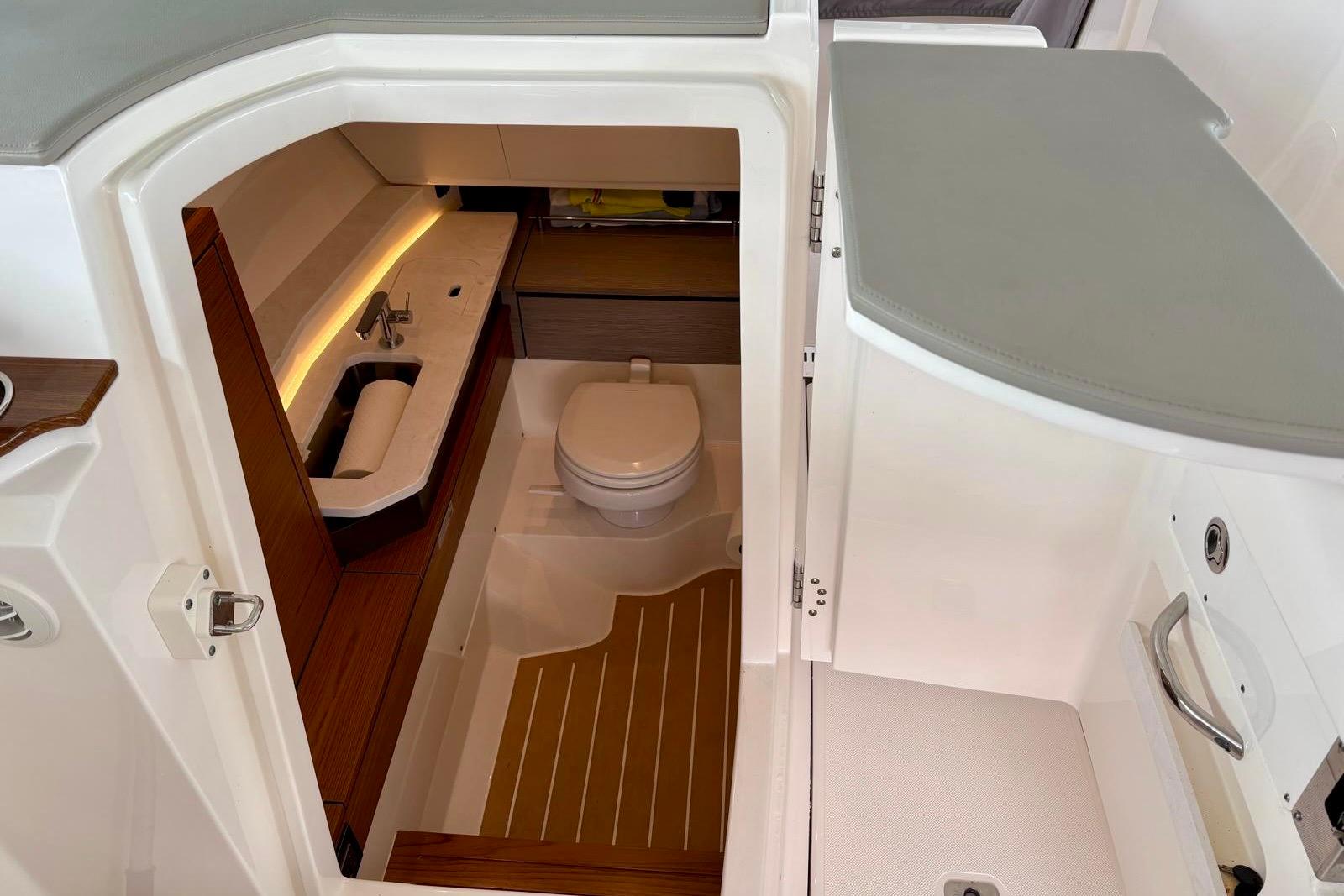2024 Tiara Yachts 34 LX interior bathroom with sink and toilet.