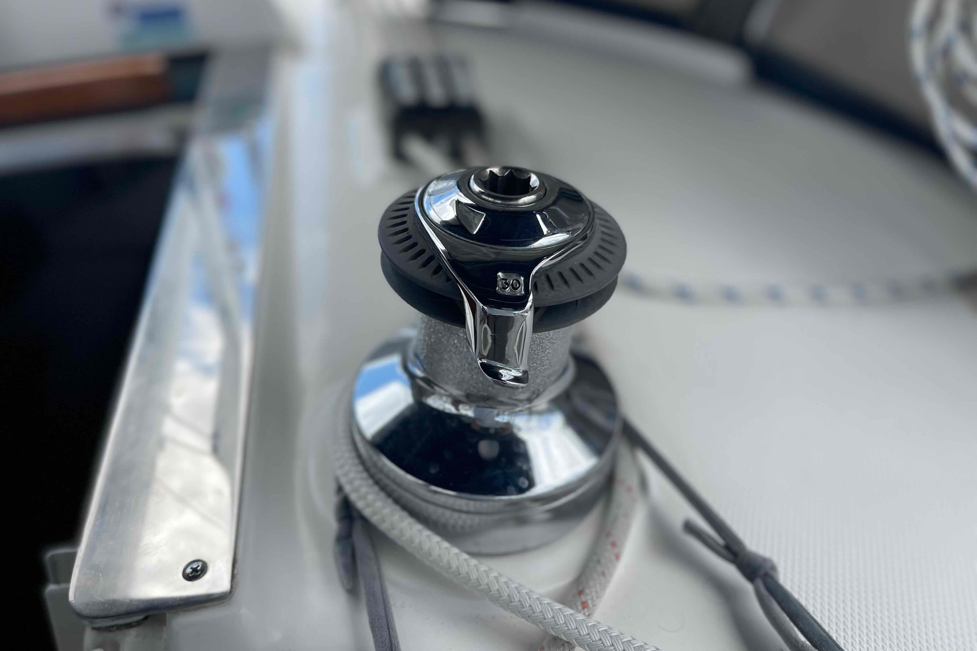 Close-up of a winch on a 2004 Hunter 36 sailboat deck.