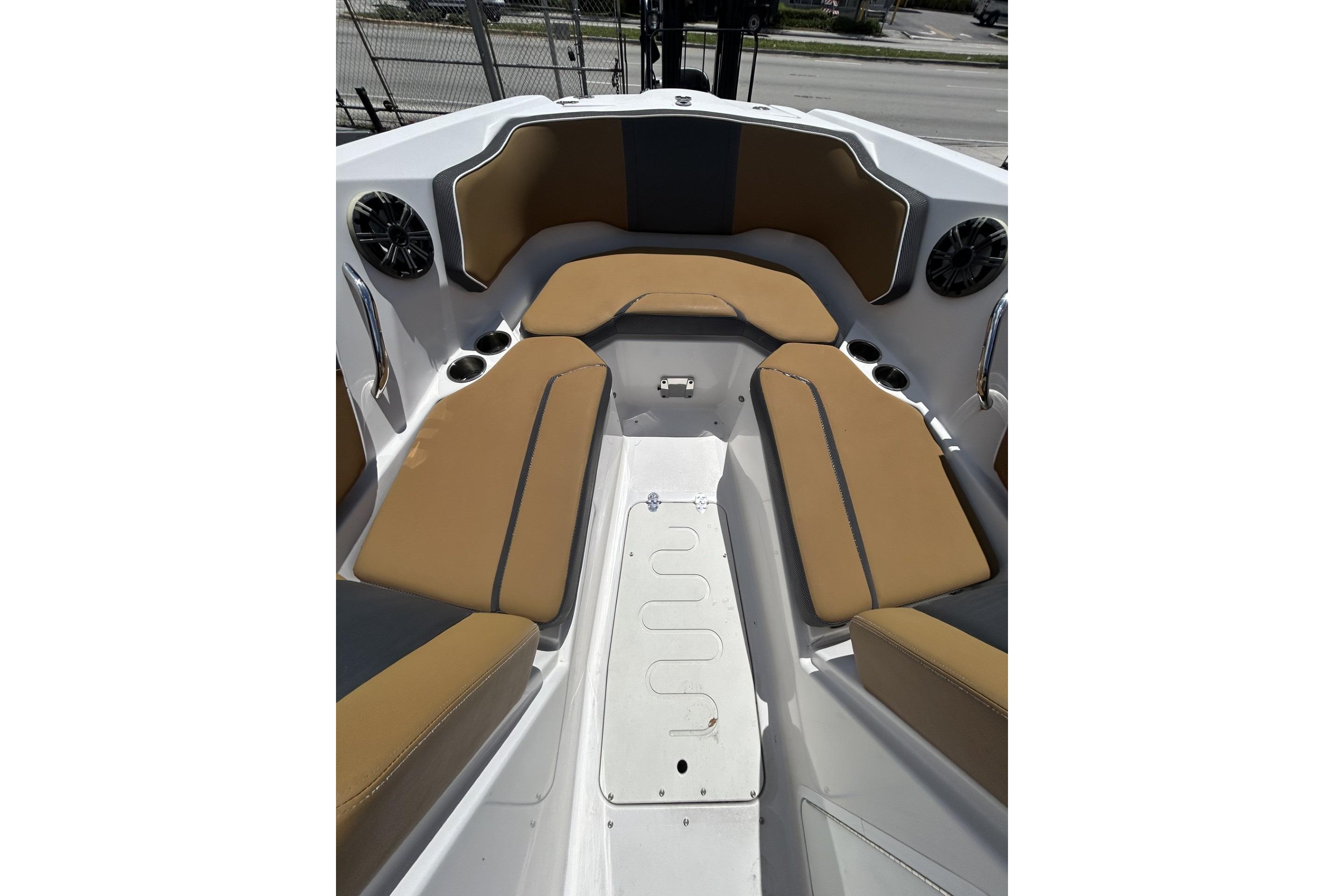 2019 Scarab 255 ID boat interior with tan seating and cup holders.