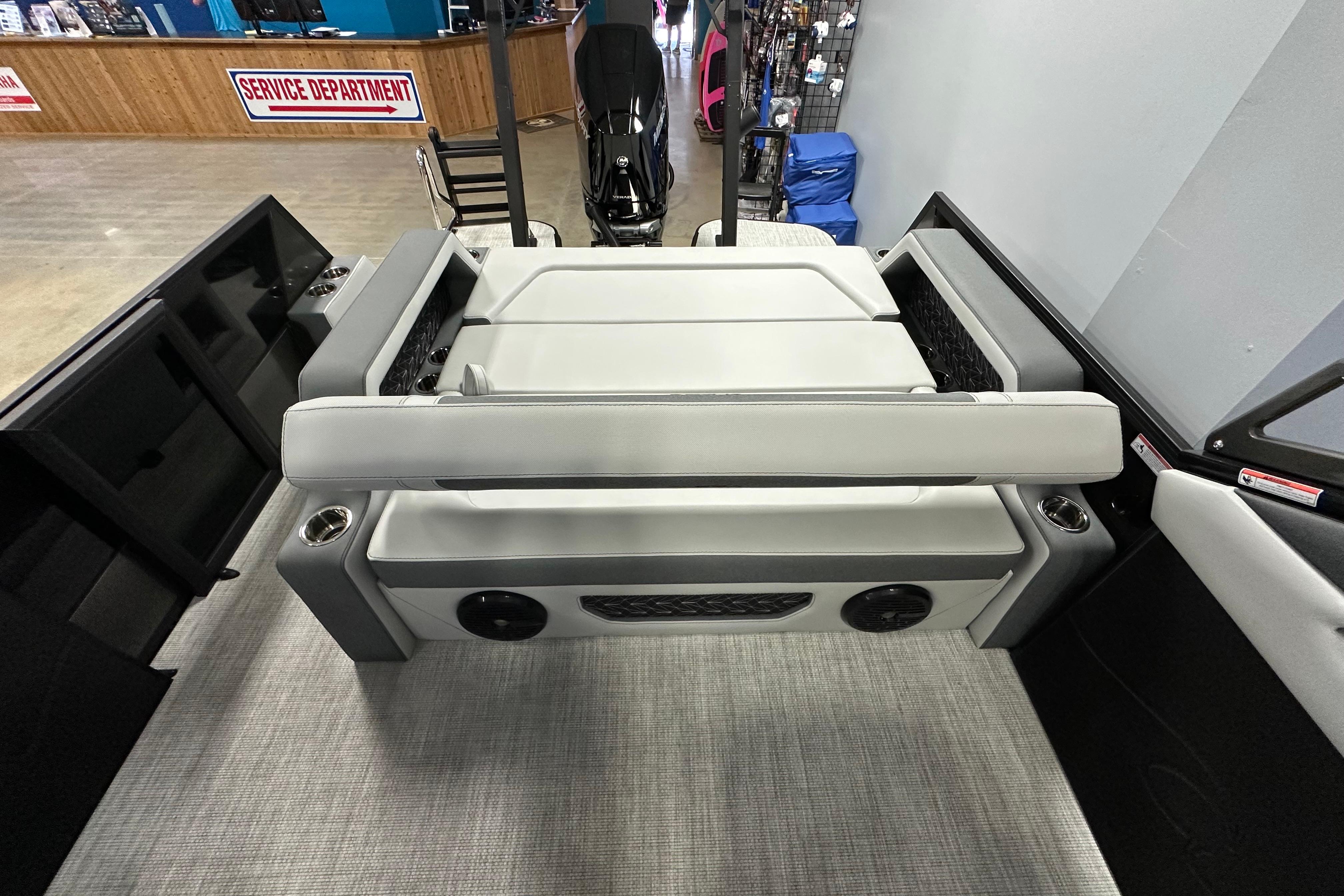 2026 Alera M25L boat interior with gray seating and cup holders.