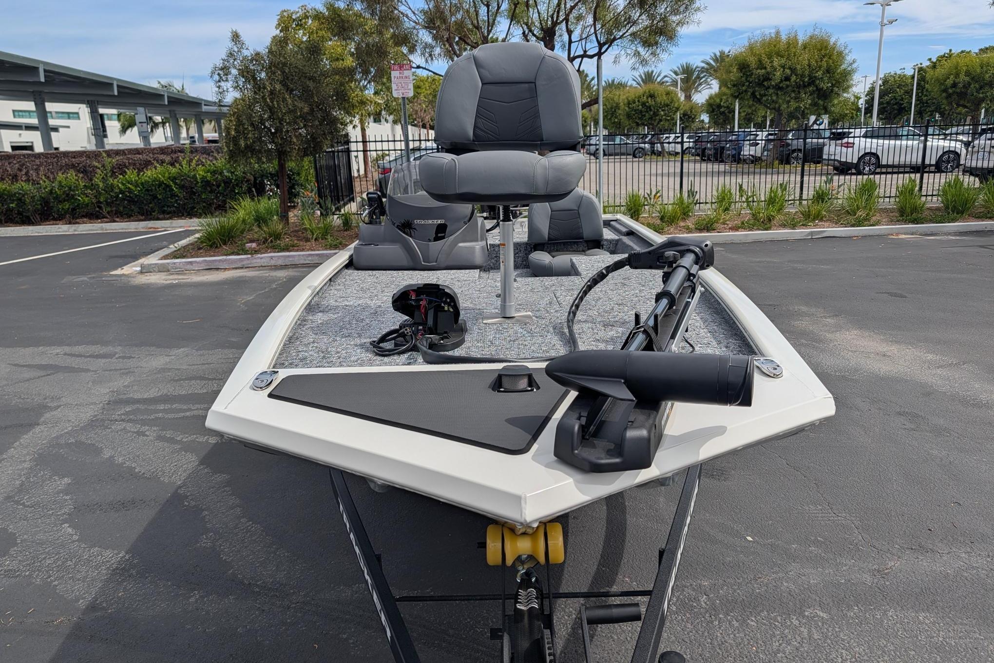 2026 Tracker Pro 170 boat parked, featuring a sleek design and modern seating.