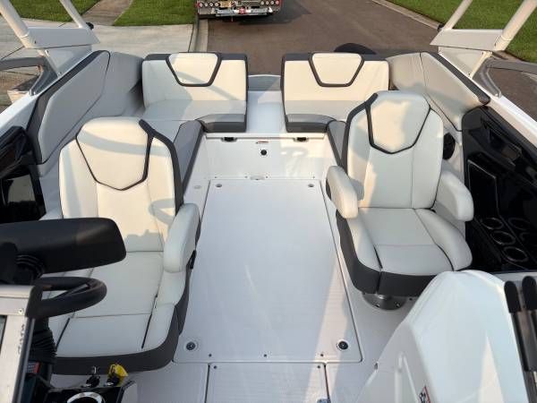 Interior of a 2021 Yamaha AR250 boat with white seating.