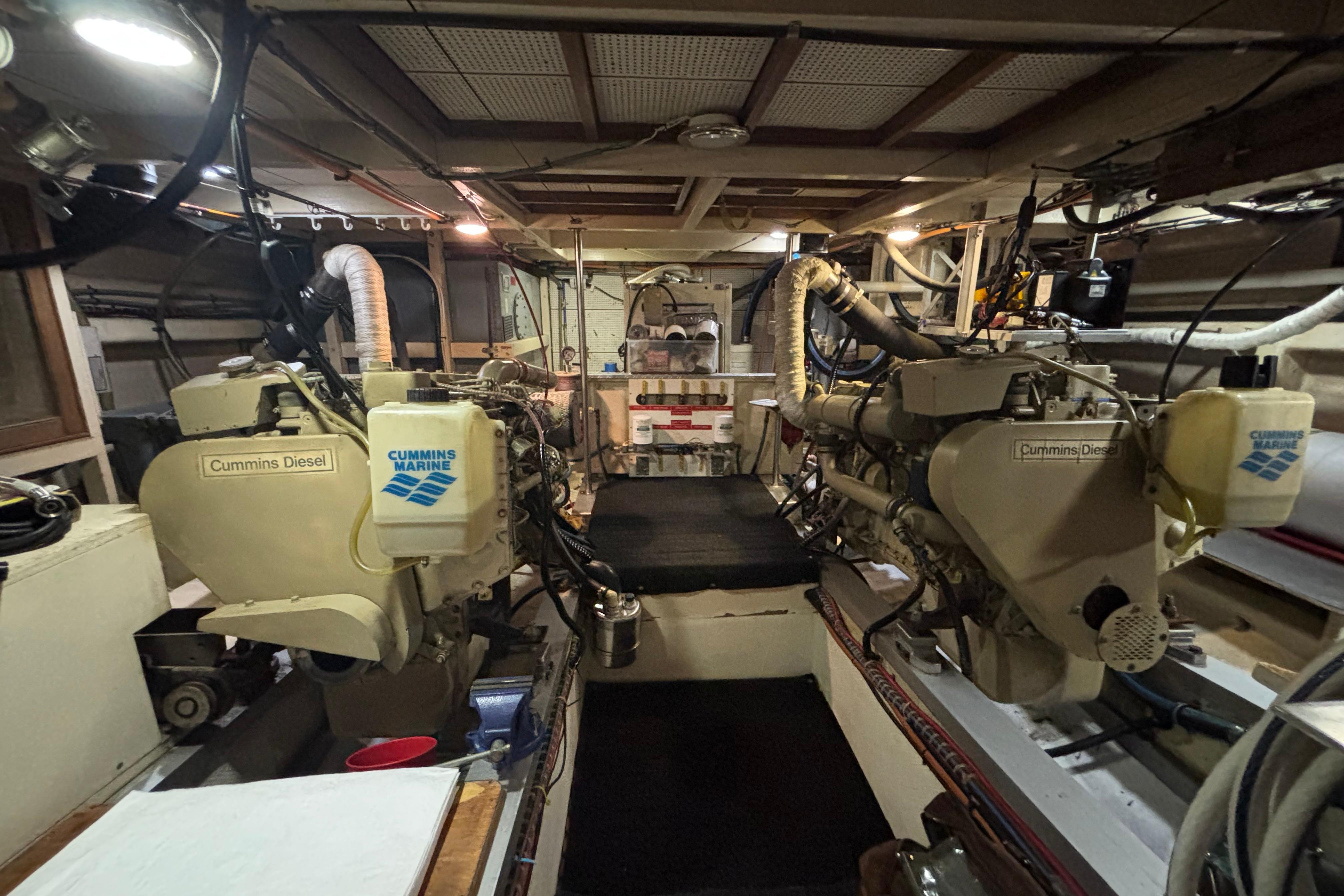 Engine room of 1989 Grand Banks 46 Classic with Cummins Diesel engines.