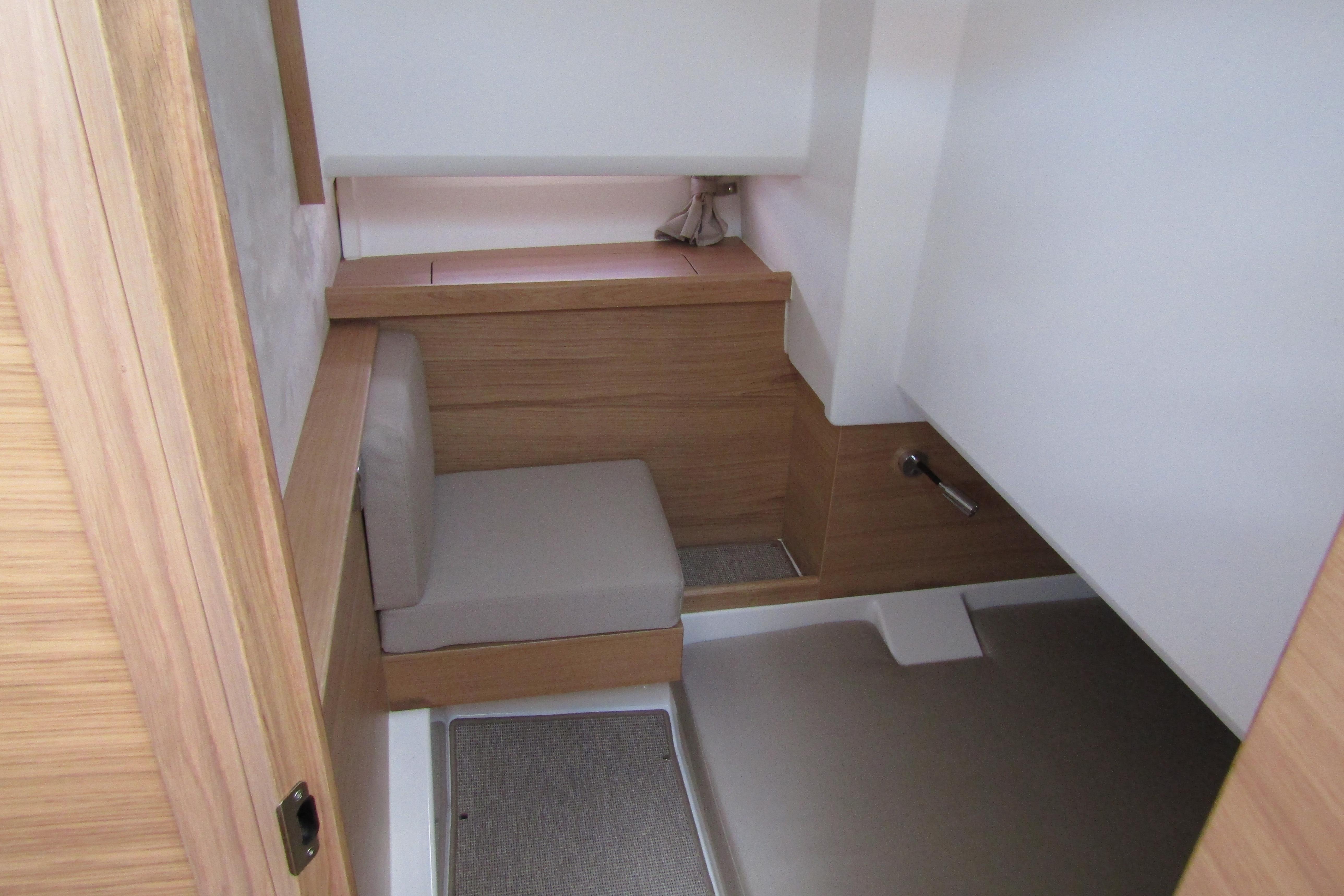 Interior of 2025 Nimbus Tender 11, featuring modern wood and white design.