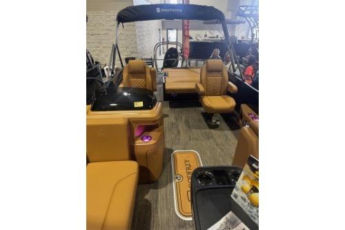 2026 Godfrey Sweetwater 2286 SFLC pontoon boat interior with tan seating and modern amenities.