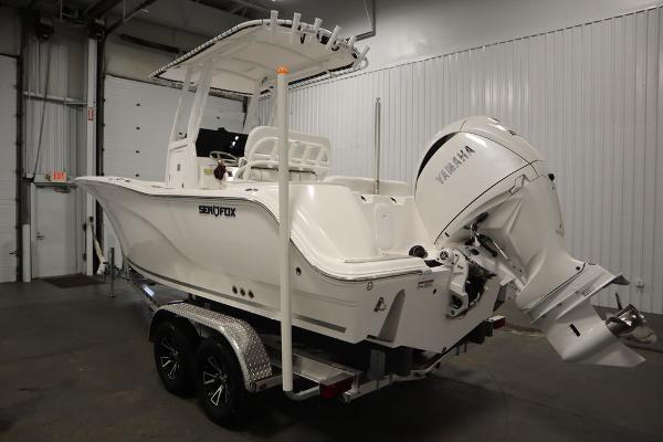 2025 Sea Fox 228 Commander boat with Yamaha engine in a garage setting.