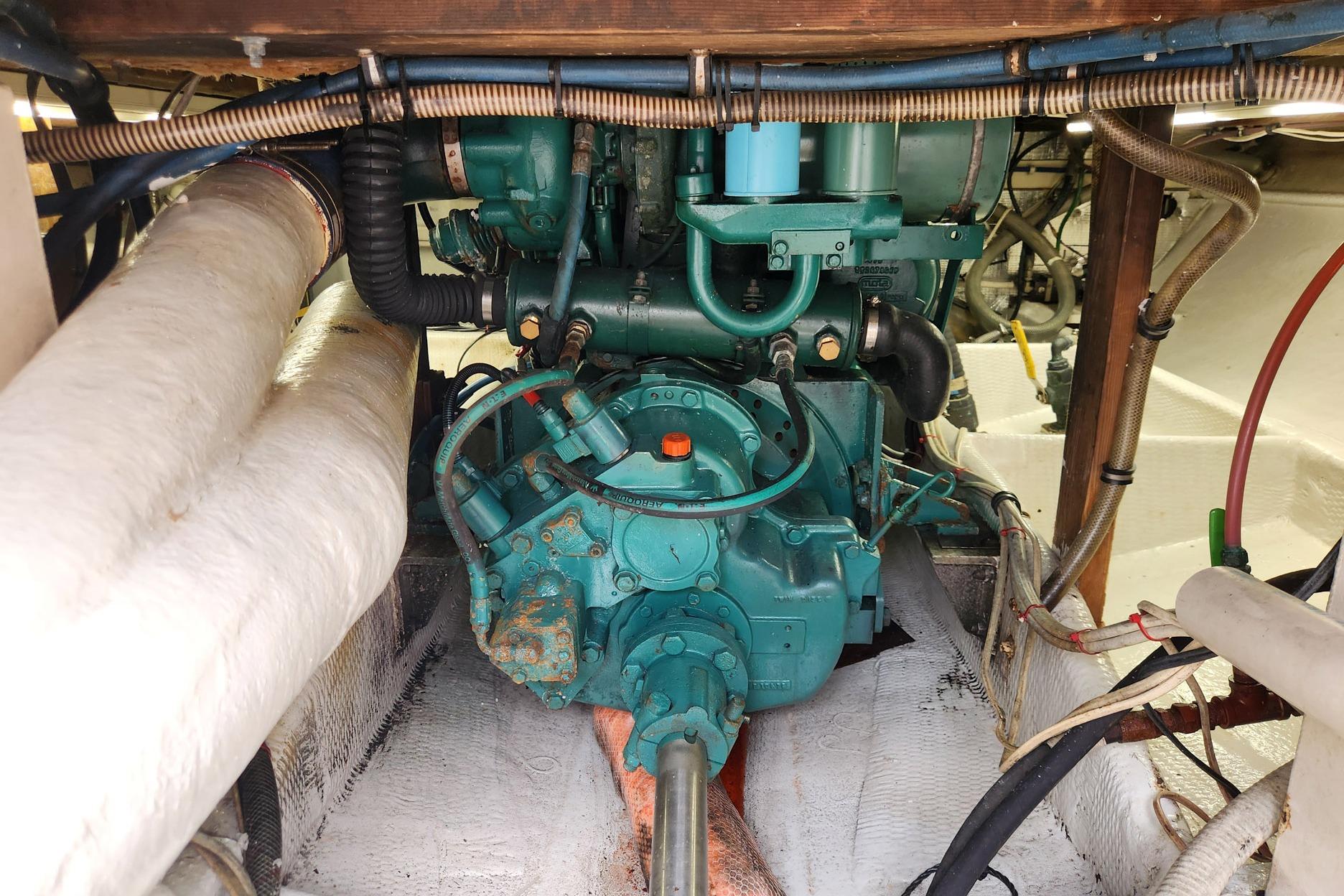 Engine room of 1987 Young Brothers Custom Sport Fish boat, showcasing mechanical components.