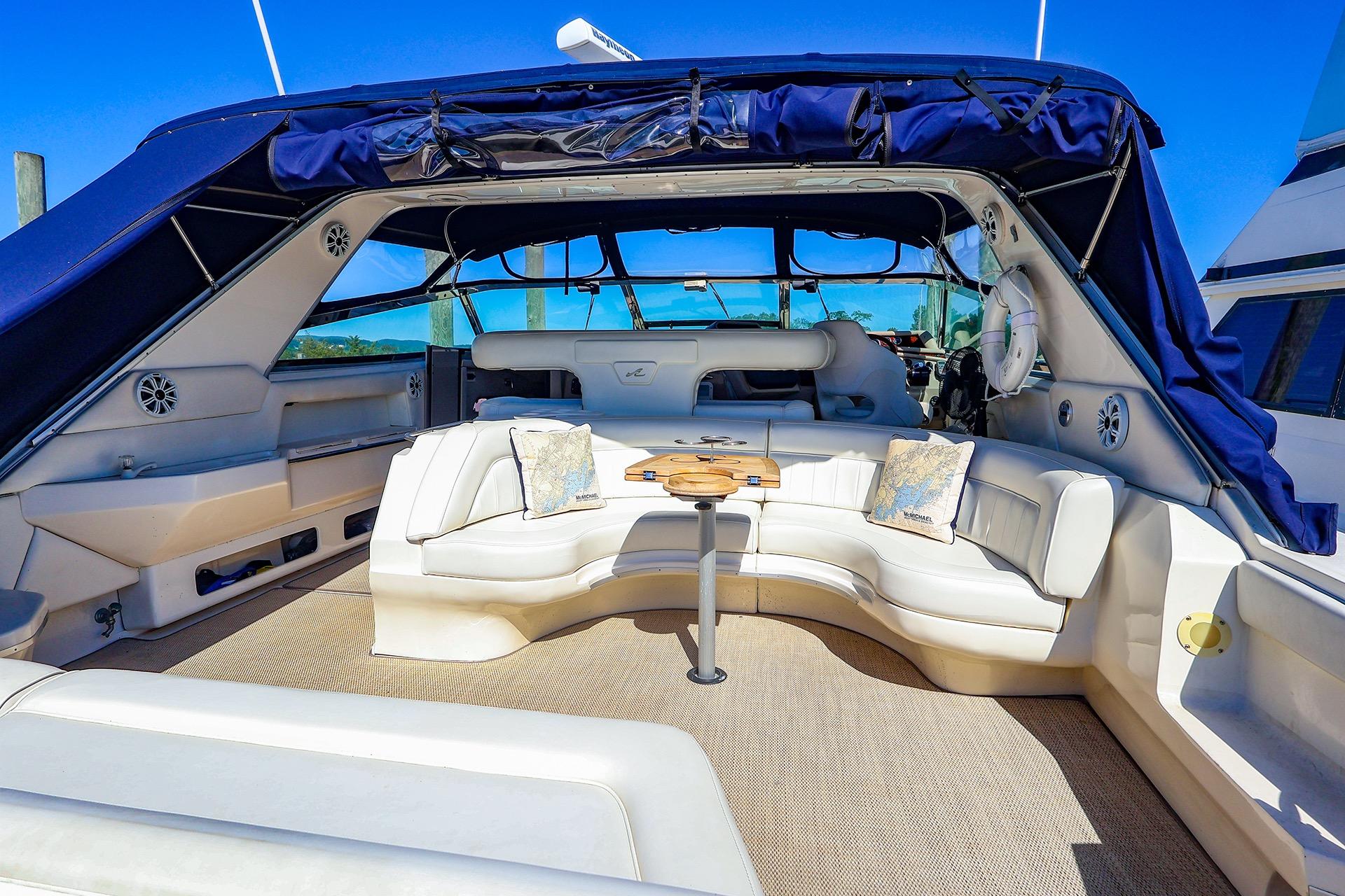 Luxurious 1998 Sea Ray 500 Sundancer yacht interior with plush seating and elegant design.