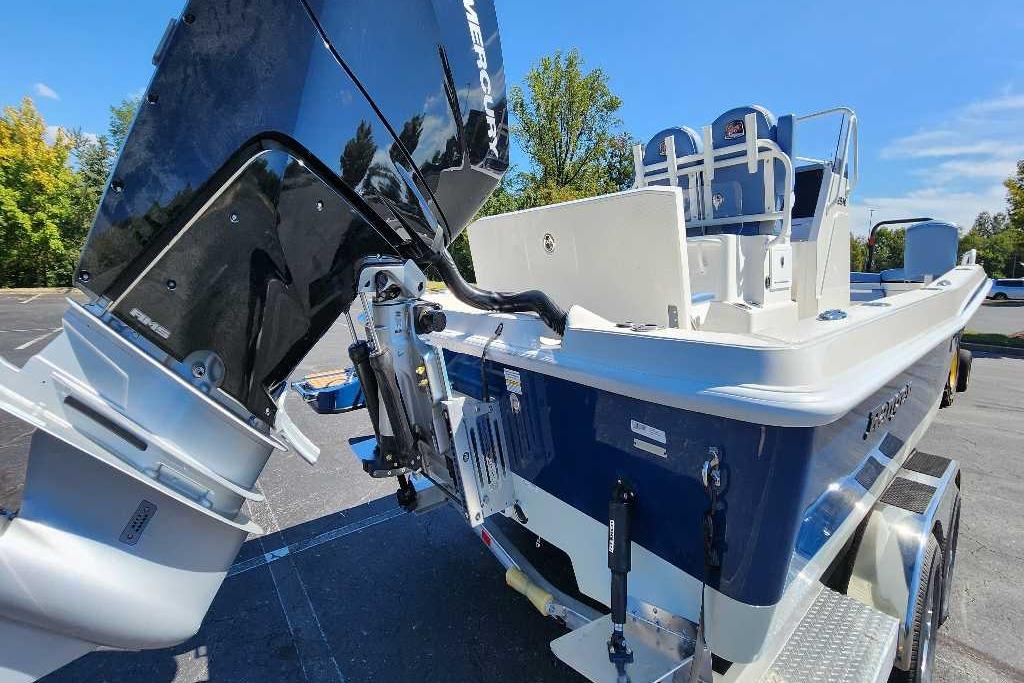 2025 Ranger 2510 Bay boat with powerful outboard motor, parked outdoors.