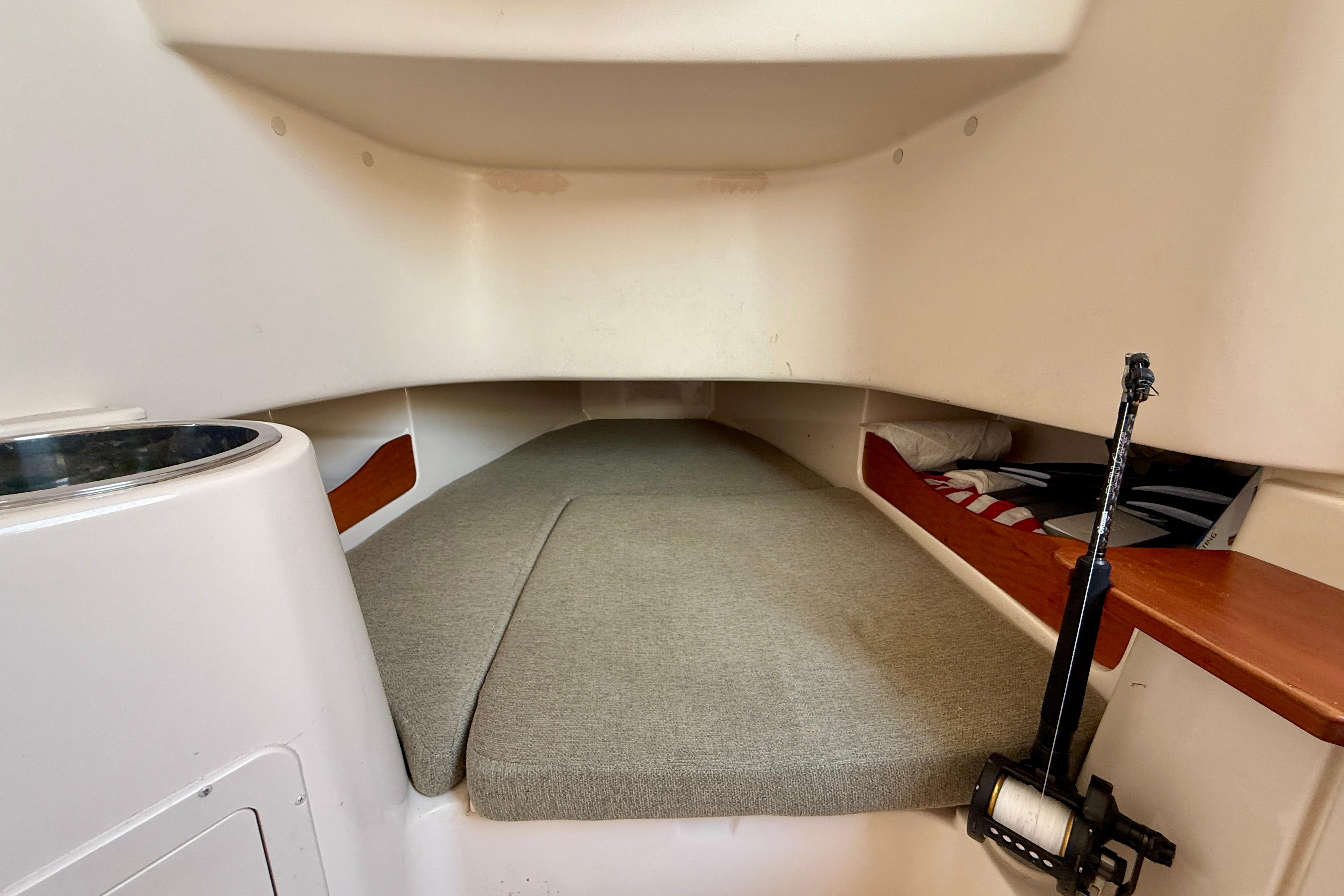 2012 Grady-White Canyon 336 cabin interior with cushioned sleeping area.