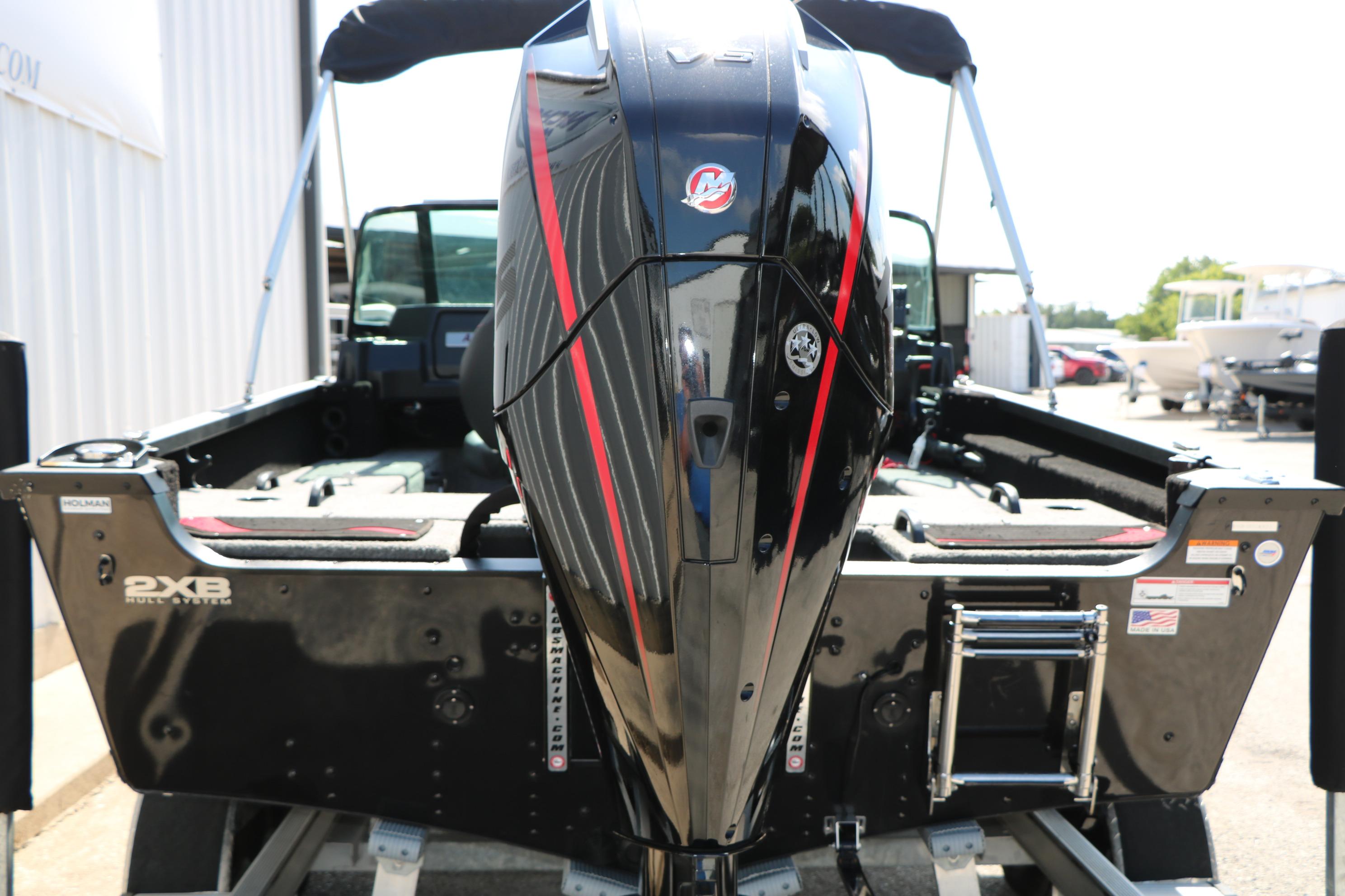 2023 Alumacraft Competitor FSX 185 boat with powerful outboard motor, rear view.