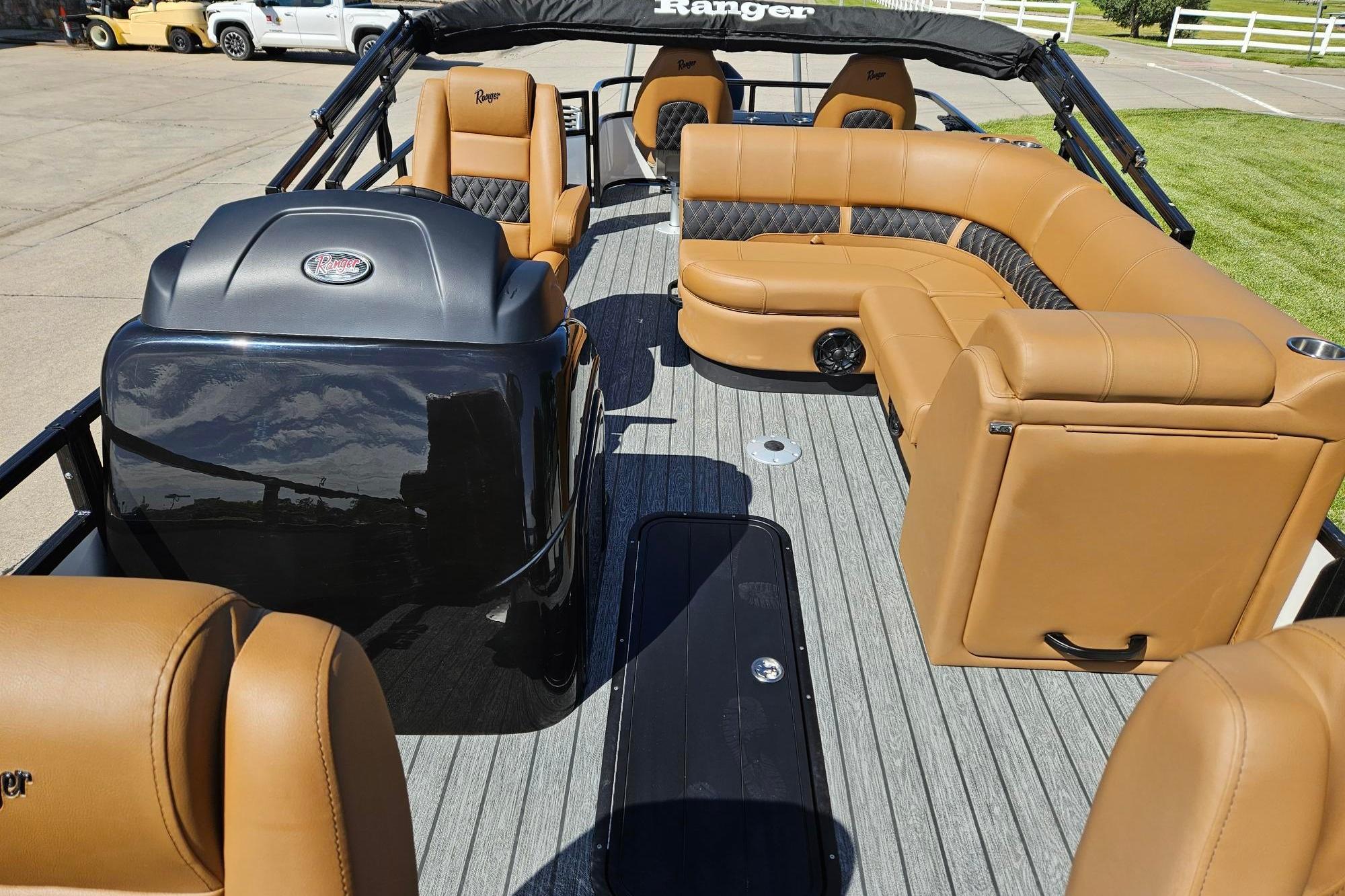 2026 Ranger 223F boat interior with tan leather seating and modern design.
