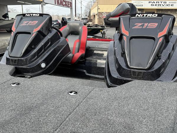 2025 Nitro Z19 boat with dual seats and sleek design in a dealership setting.