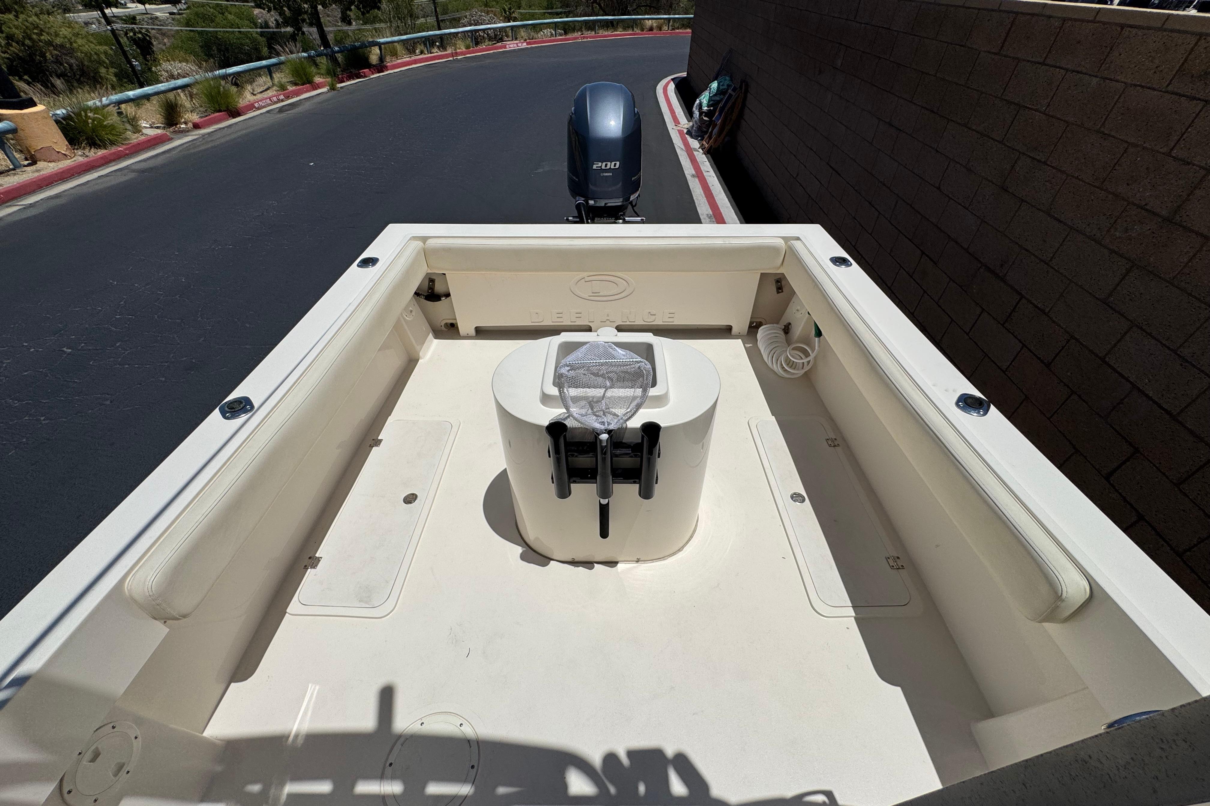 2017 Defiance Admiral 220 EX boat interior with seating and outboard motor.