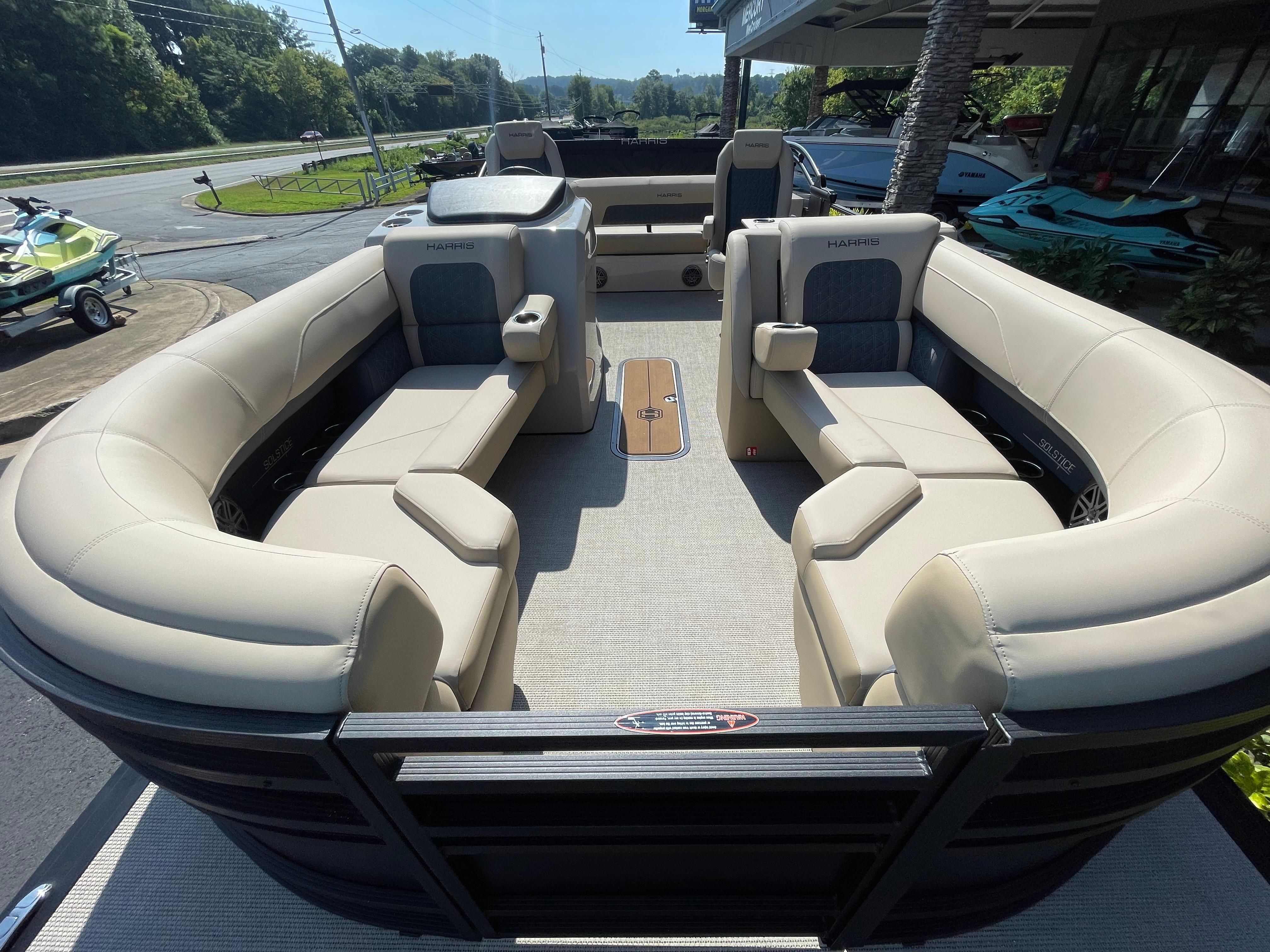 Luxurious interior of 2026 Harris Solstice 230 pontoon boat with plush seating.