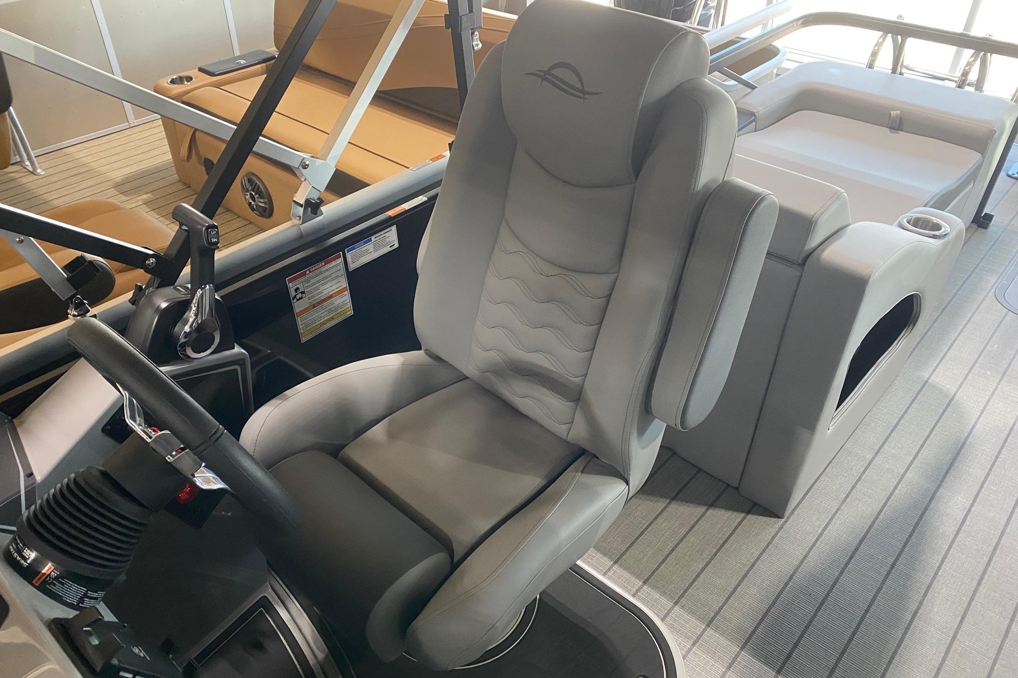 Luxurious interior of 2026 SunCatcher Fusion 324SS boat with plush seating and modern controls.