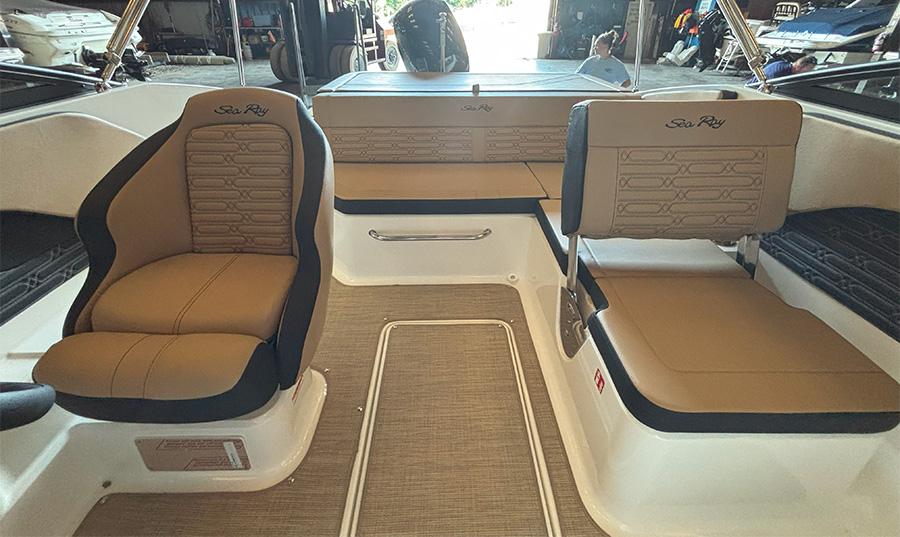 2025 Sea Ray SPX 190 Outboard interior with tan seating and modern design.