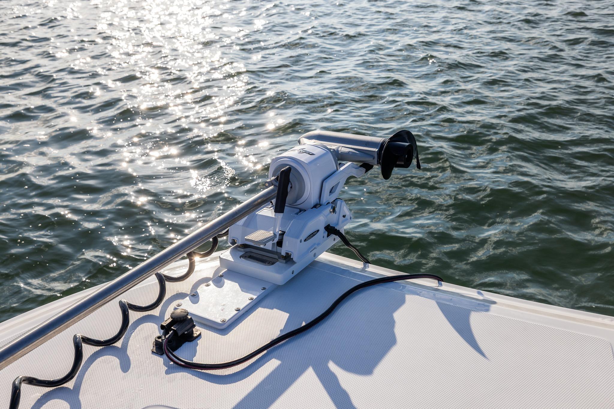 Bow of 2026 Front Runner 37 Catamaran with trolling motor on calm water.