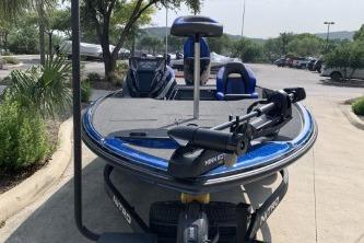 2026 Nitro Z20 XL boat with trolling motor, parked outdoors on a sunny day.