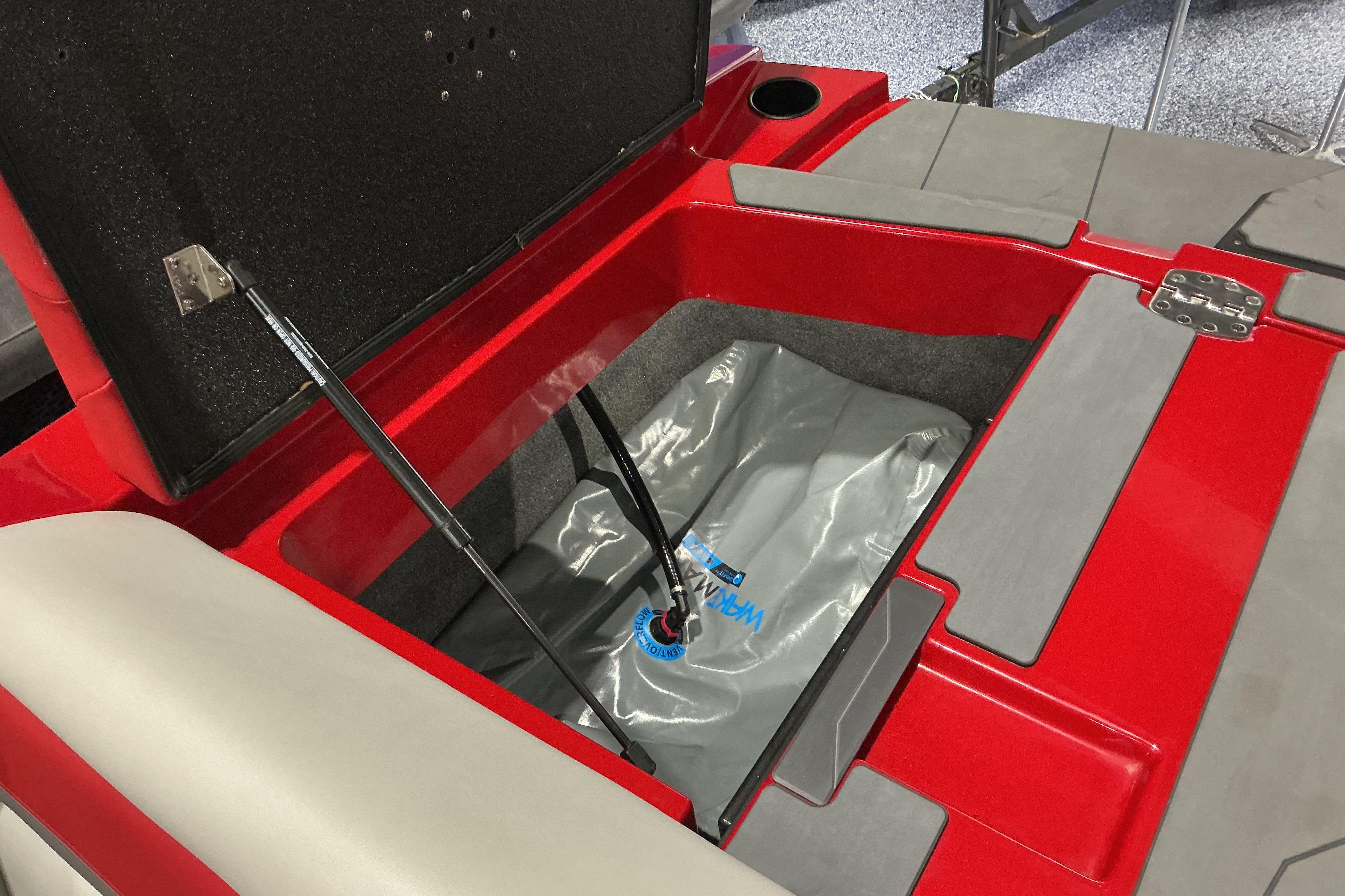 Open storage compartment in 2022 Axis T250 boat with ballast bag.