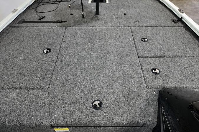 2024 Lowe Stinger 188 boat deck with gray carpet and storage compartments.