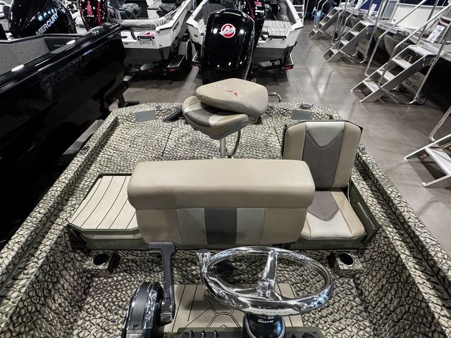2025 Vexus ACX2000 boat interior with camo design and modern steering wheel.