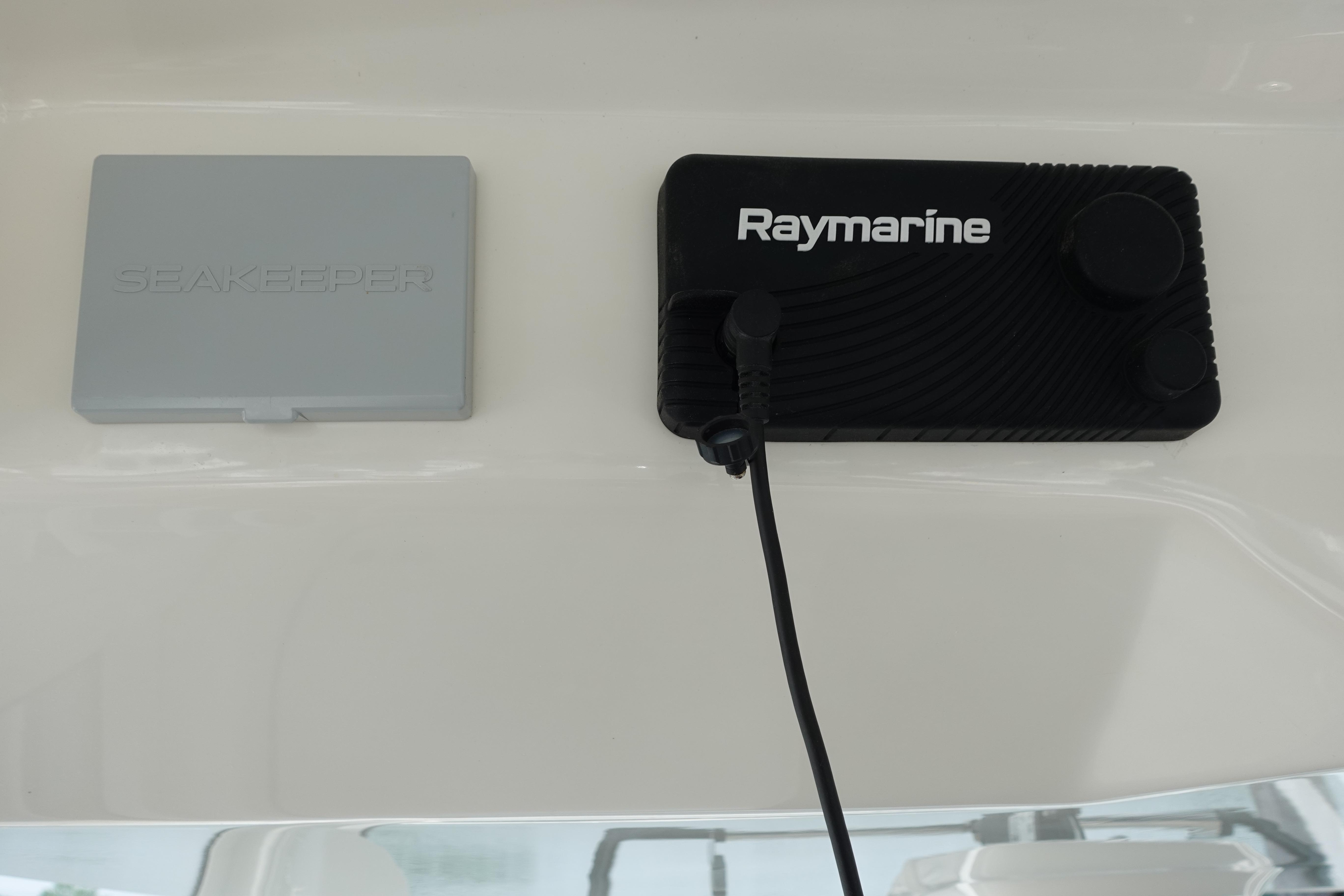 Raymarine and Seakeeper controls on 2020 Boston Whaler 420 Outrage boat dashboard.
