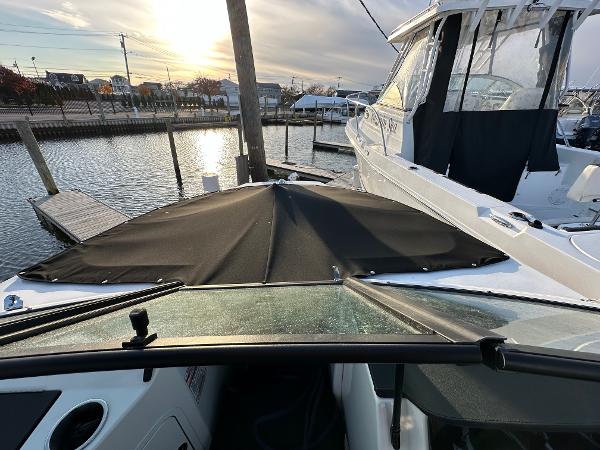 2021 Sea Ray SPX 190 boat docked at marina during sunset.