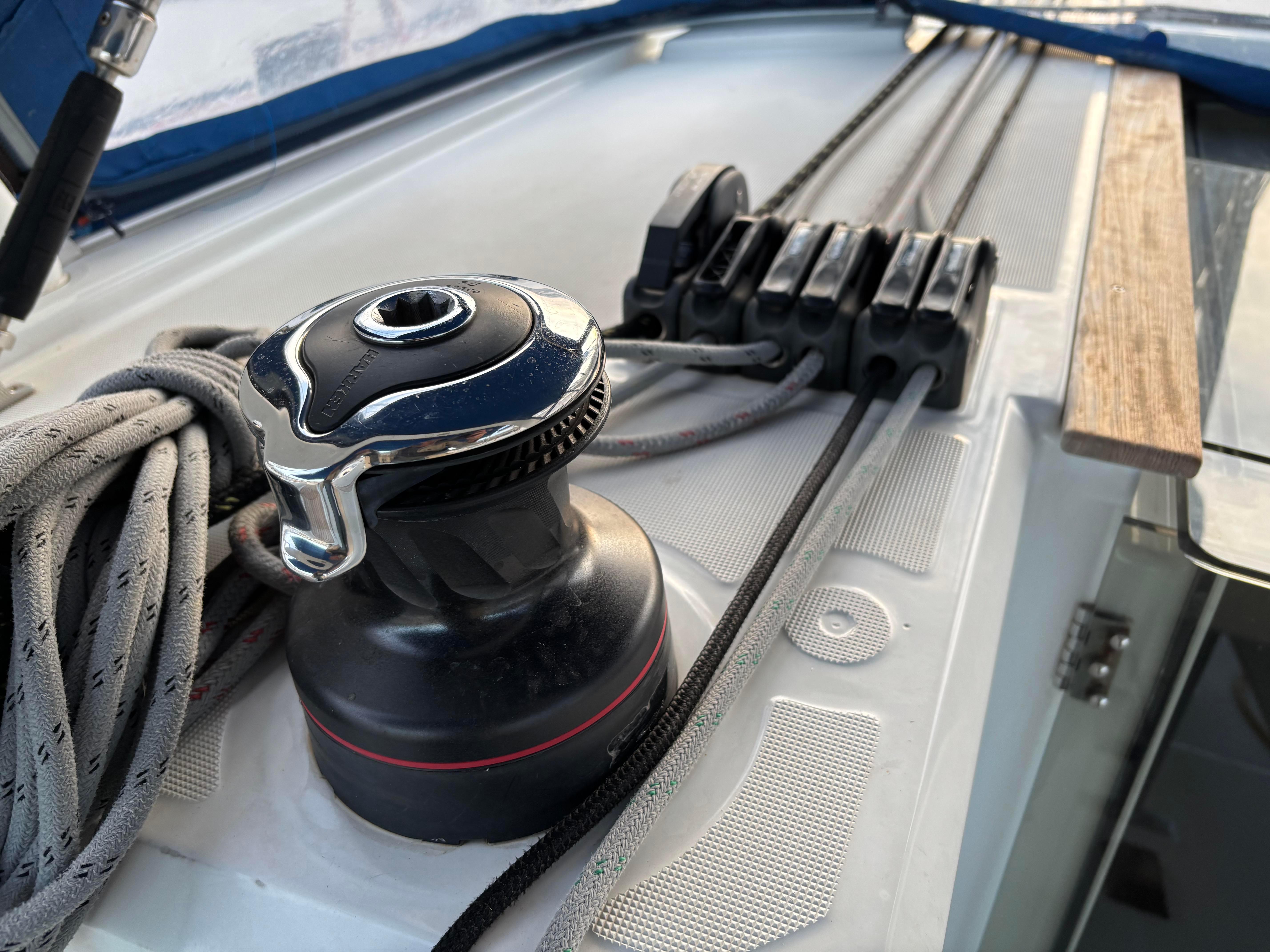 Winch and ropes on 2019 Beneteau Oceanis 38.1 sailboat deck.