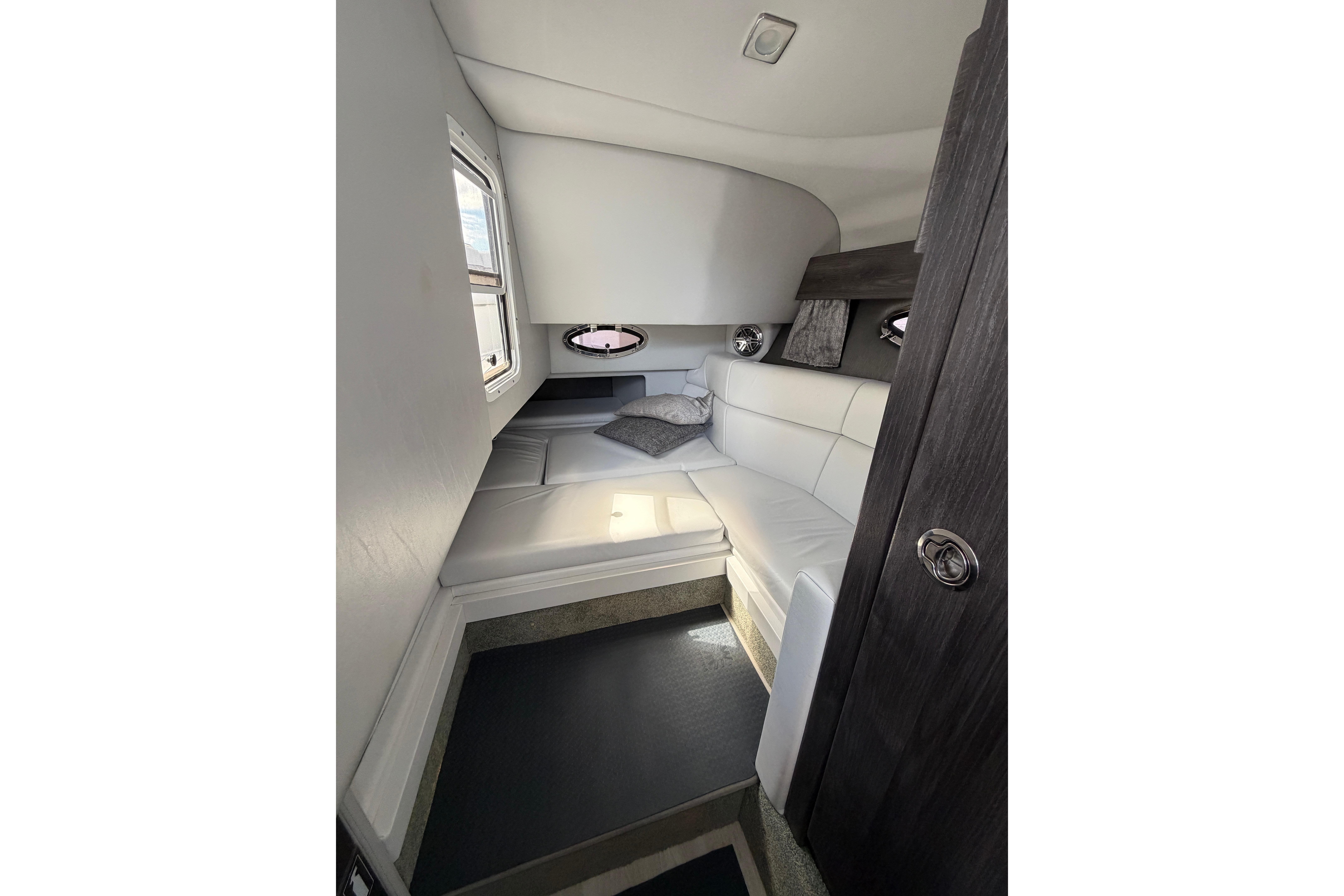 2020 Formula 330 Crossover Bowrider OB cabin interior with white seating and modern design.