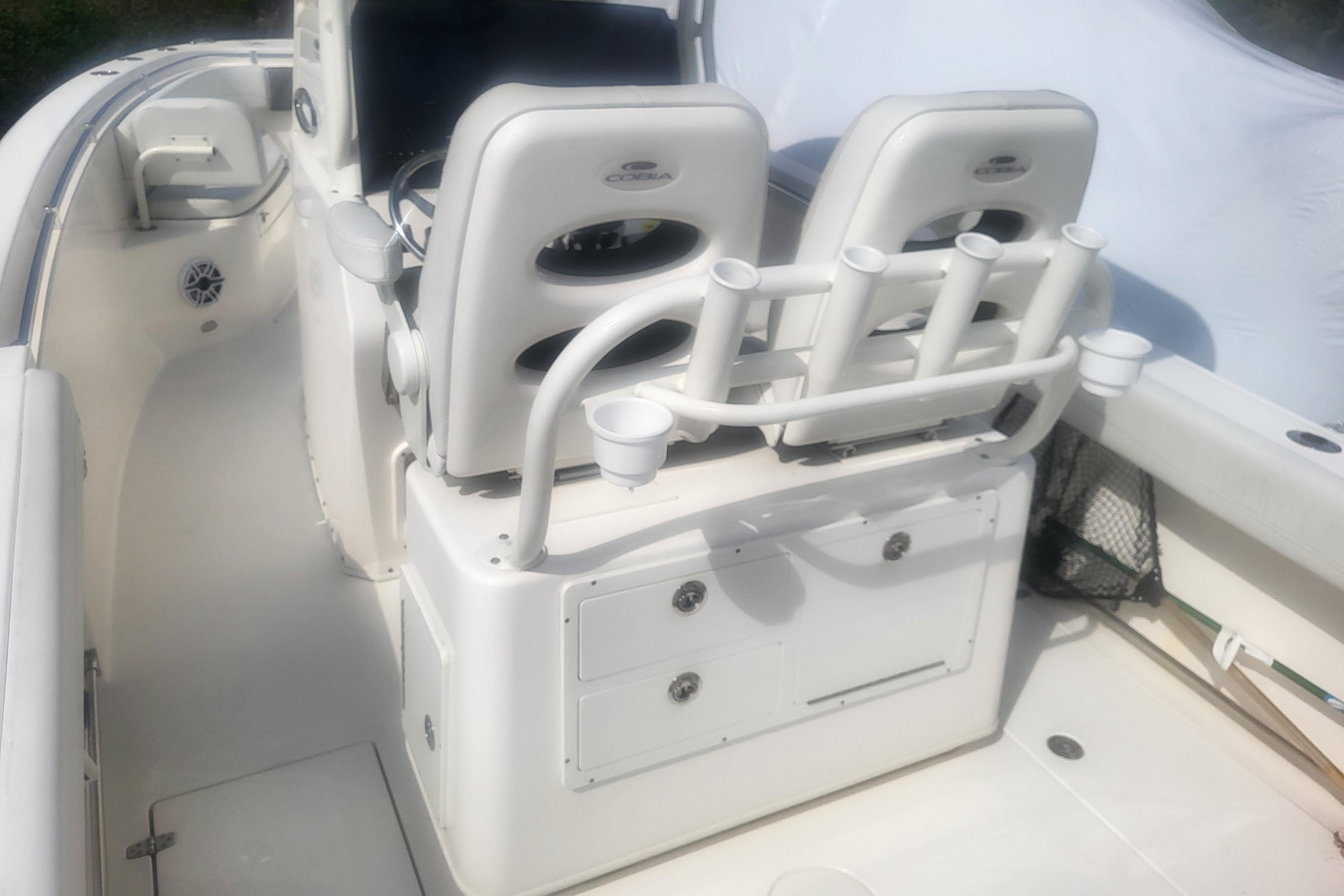 2022 Cobia 262 Center Console boat interior with seating and rod holders.