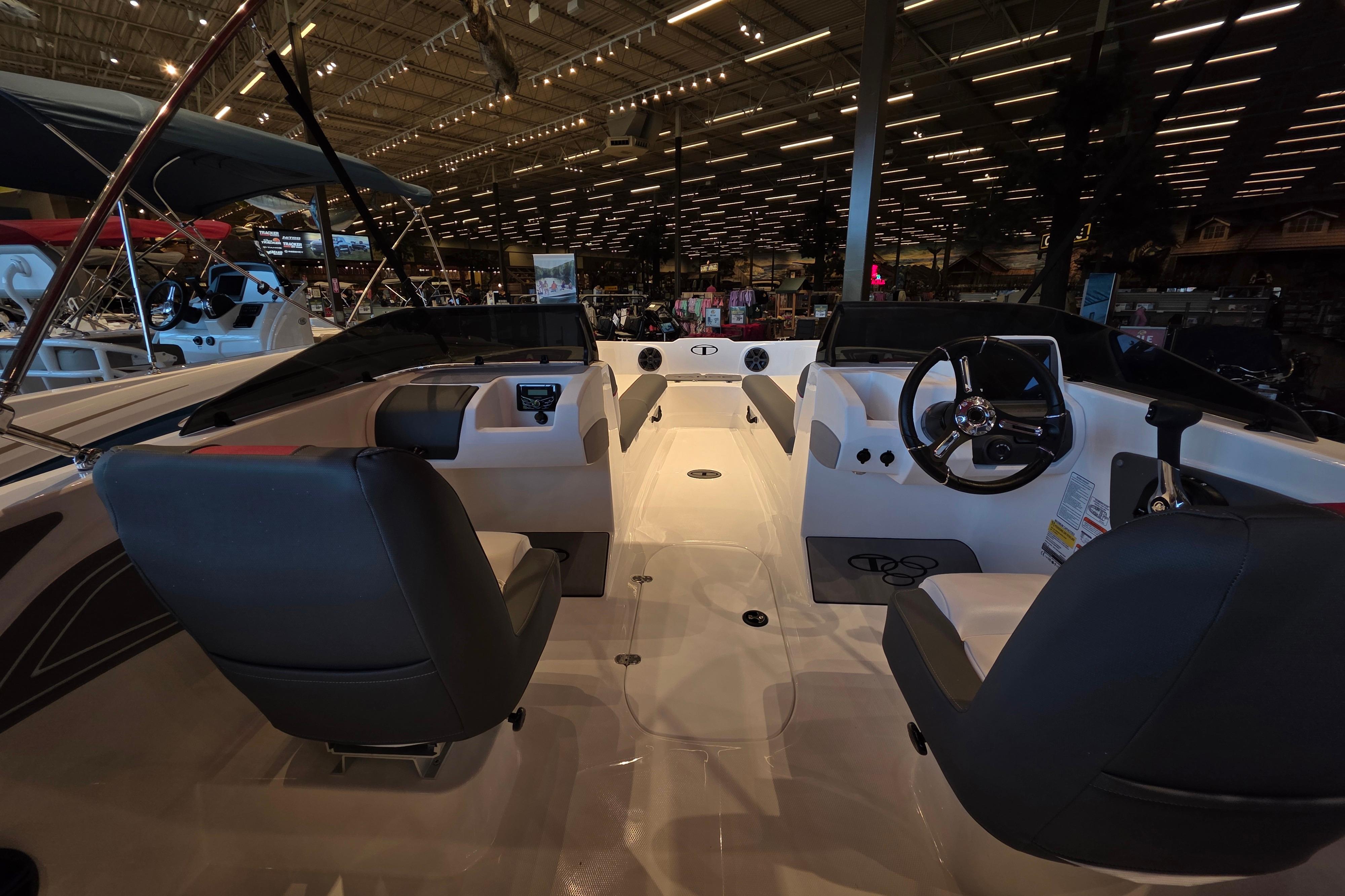 Interior view of 2026 Tahoe T21 boat, featuring sleek seating and modern dashboard.