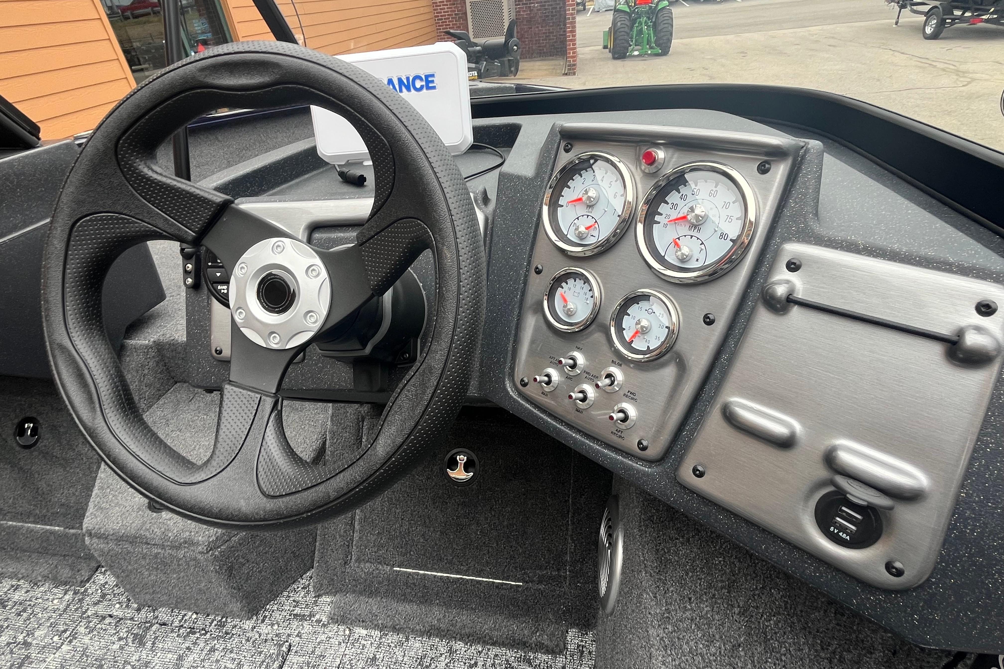 2026 Tracker Pro Guide V-175 WT dashboard with steering wheel and gauges.