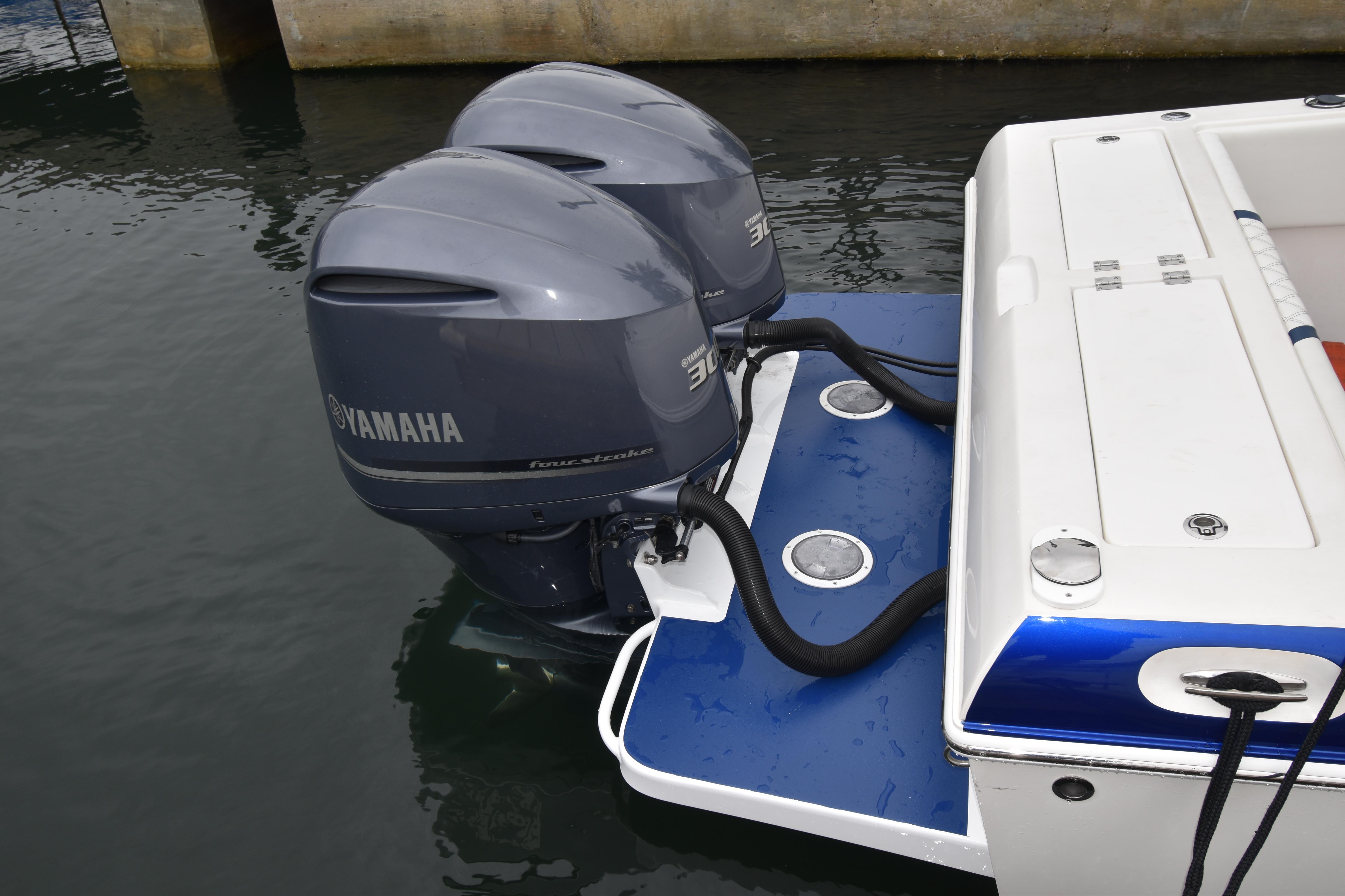 1984 Chris-Craft Scorpion with dual Yamaha outboard motors on water.