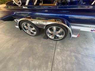 1980 Sanger HYDRO V DRIVE with shiny rims on a trailer.