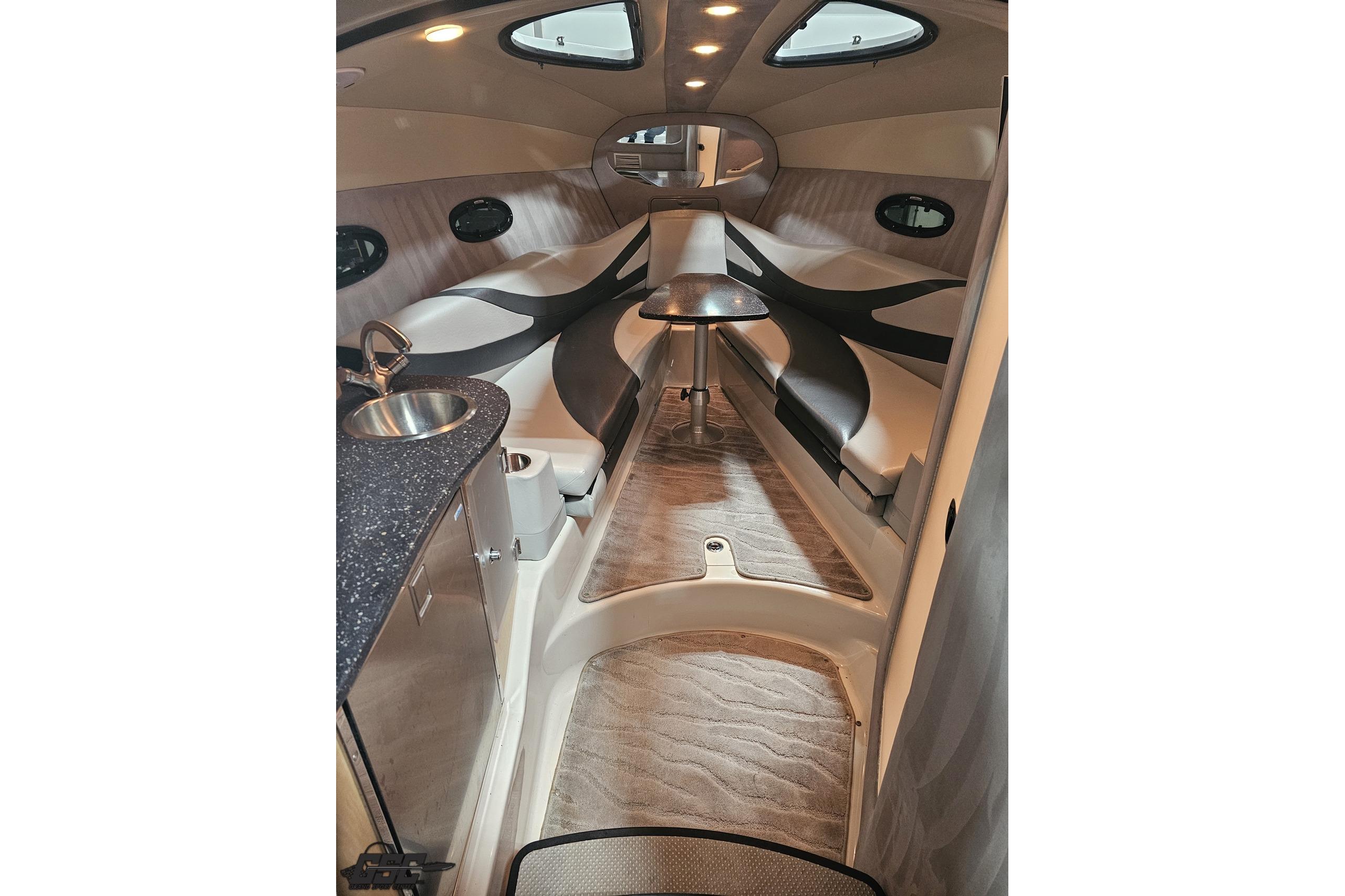 Interior of a 2008 Baja 335 Performance boat with modern seating and kitchenette.
