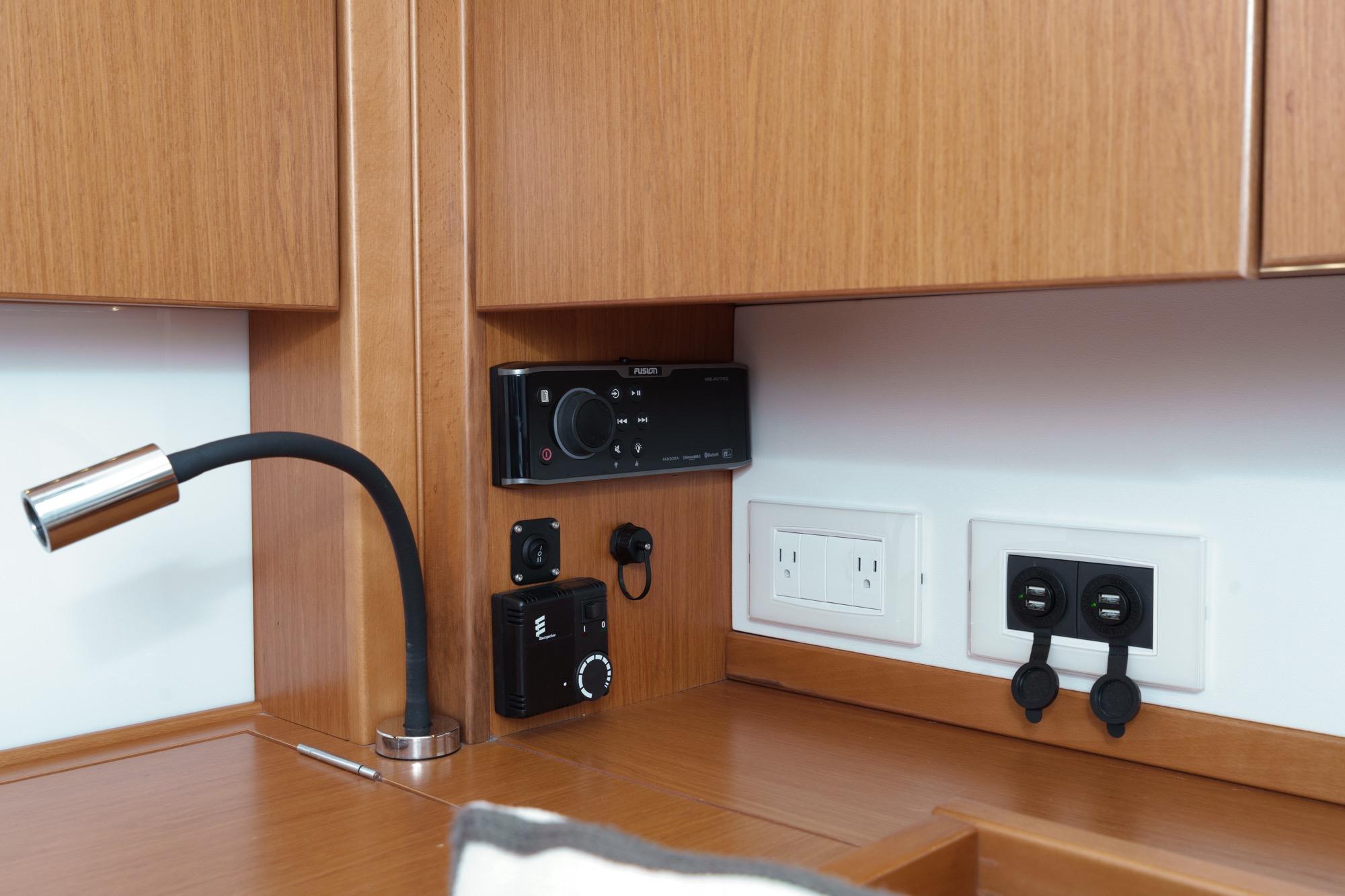 Interior of 2017 Beneteau Sense 50 yacht with modern electrical panel and sleek wood finish.