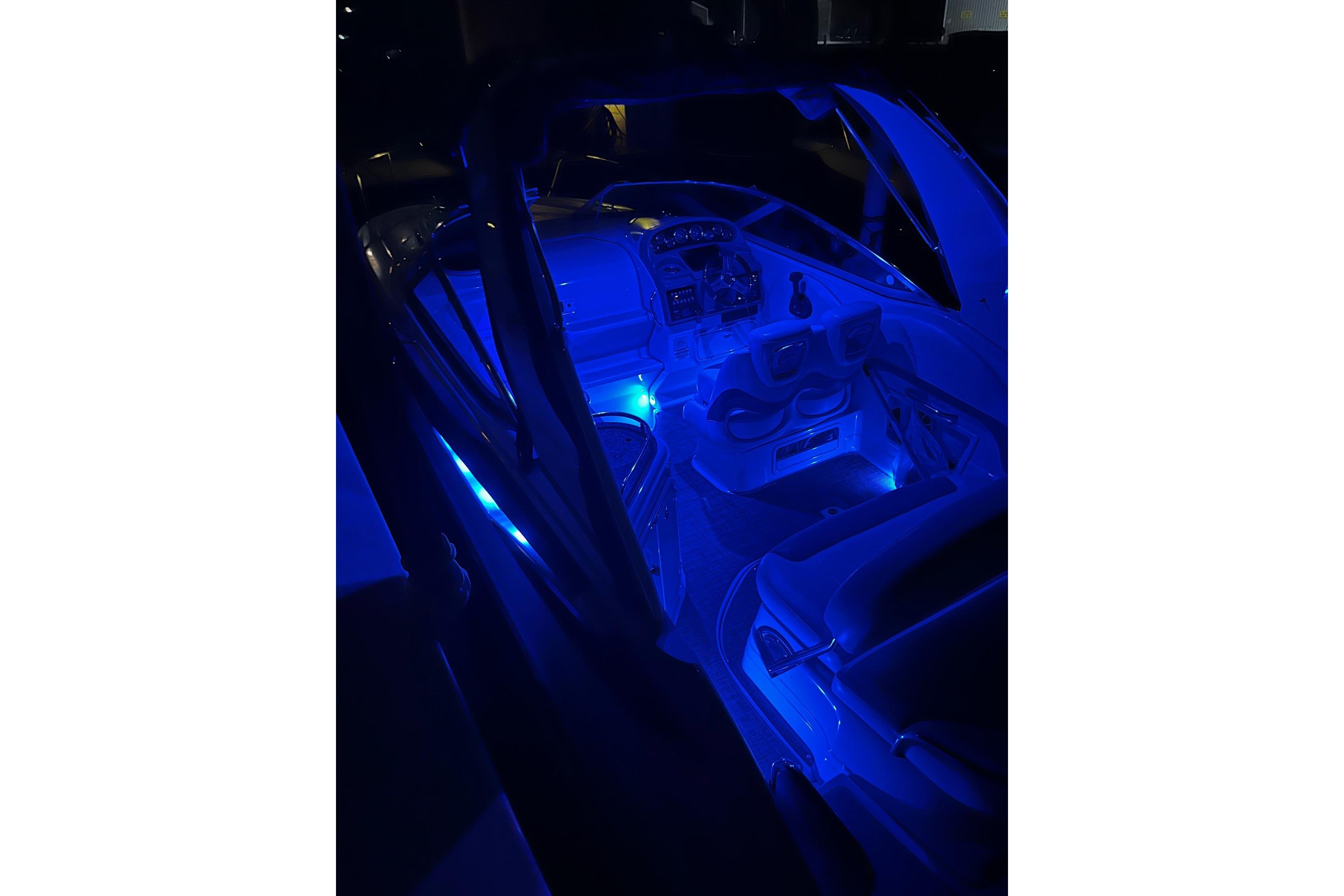 2016 Crownline 264 CR boat interior with blue ambient lighting at night.