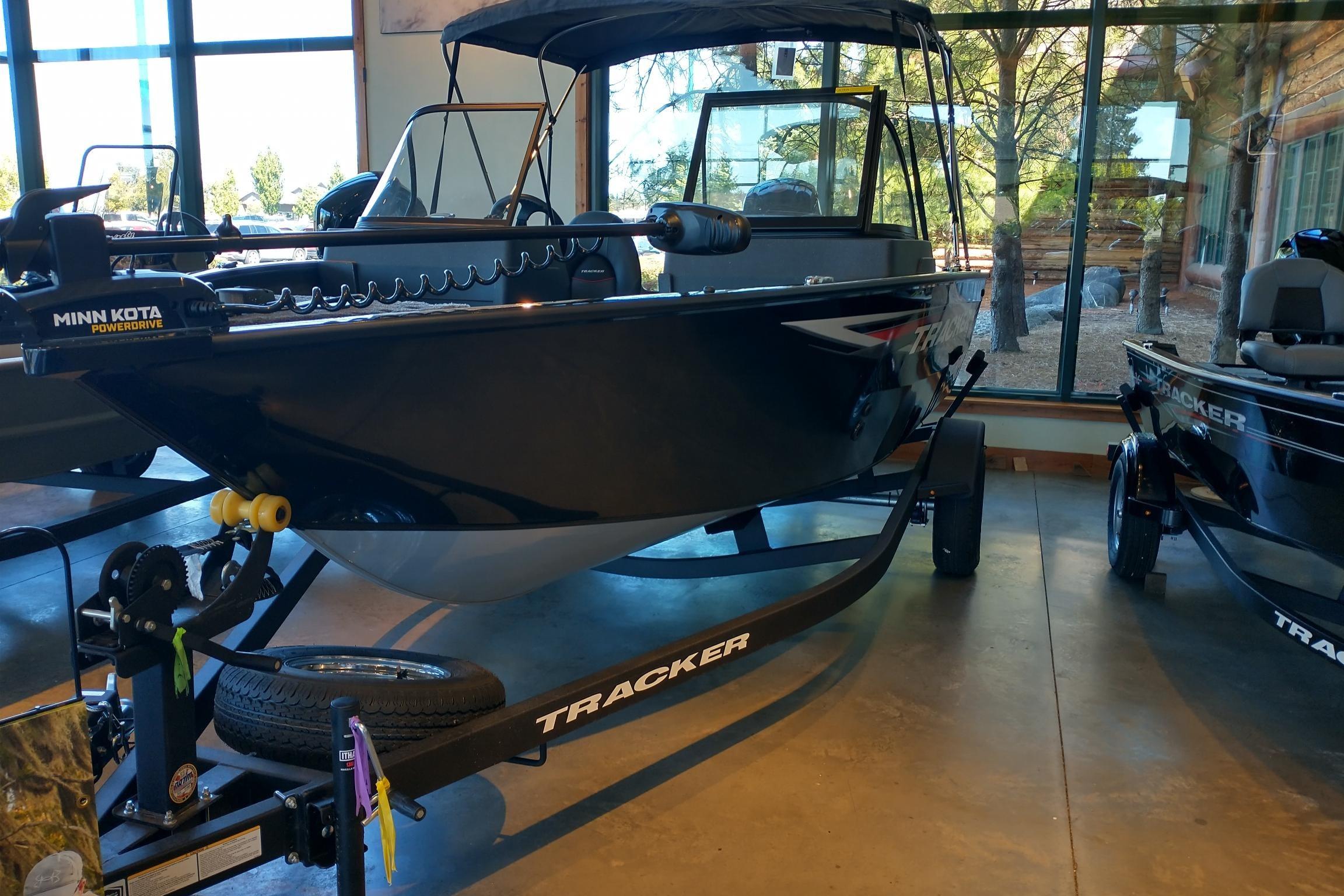 2026 Tracker Pro Guide V-175 WT boat displayed indoors with Minn Kota PowerDrive motor.