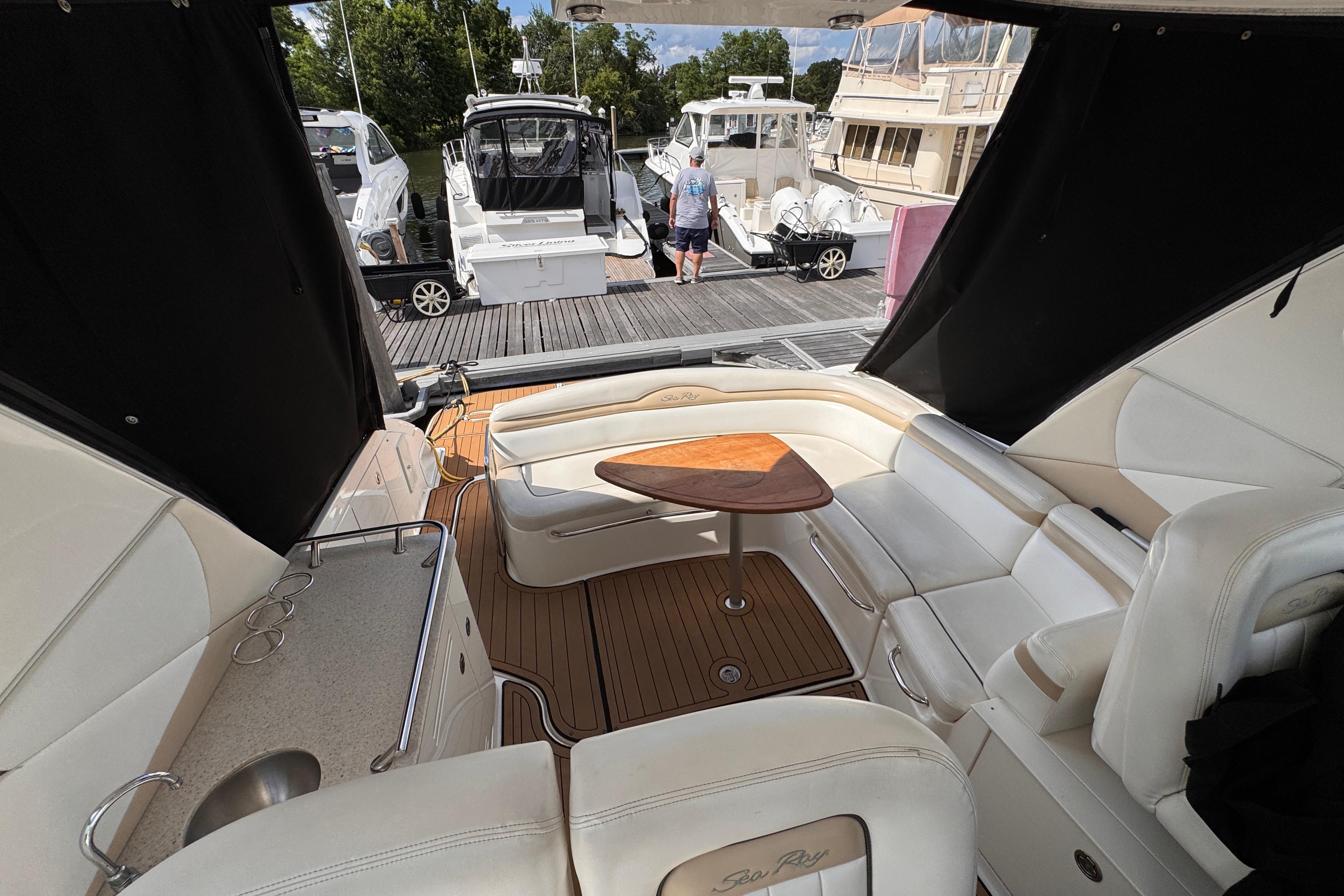 Luxurious interior of a 2008 Sea Ray Sundancer 350 yacht at a marina.