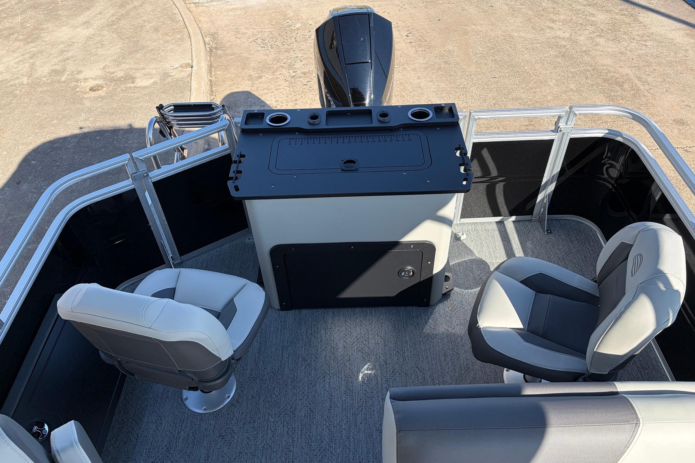 2026 Sun Tracker Fishin' Barge 22 XP3 interior with seating and control console.
