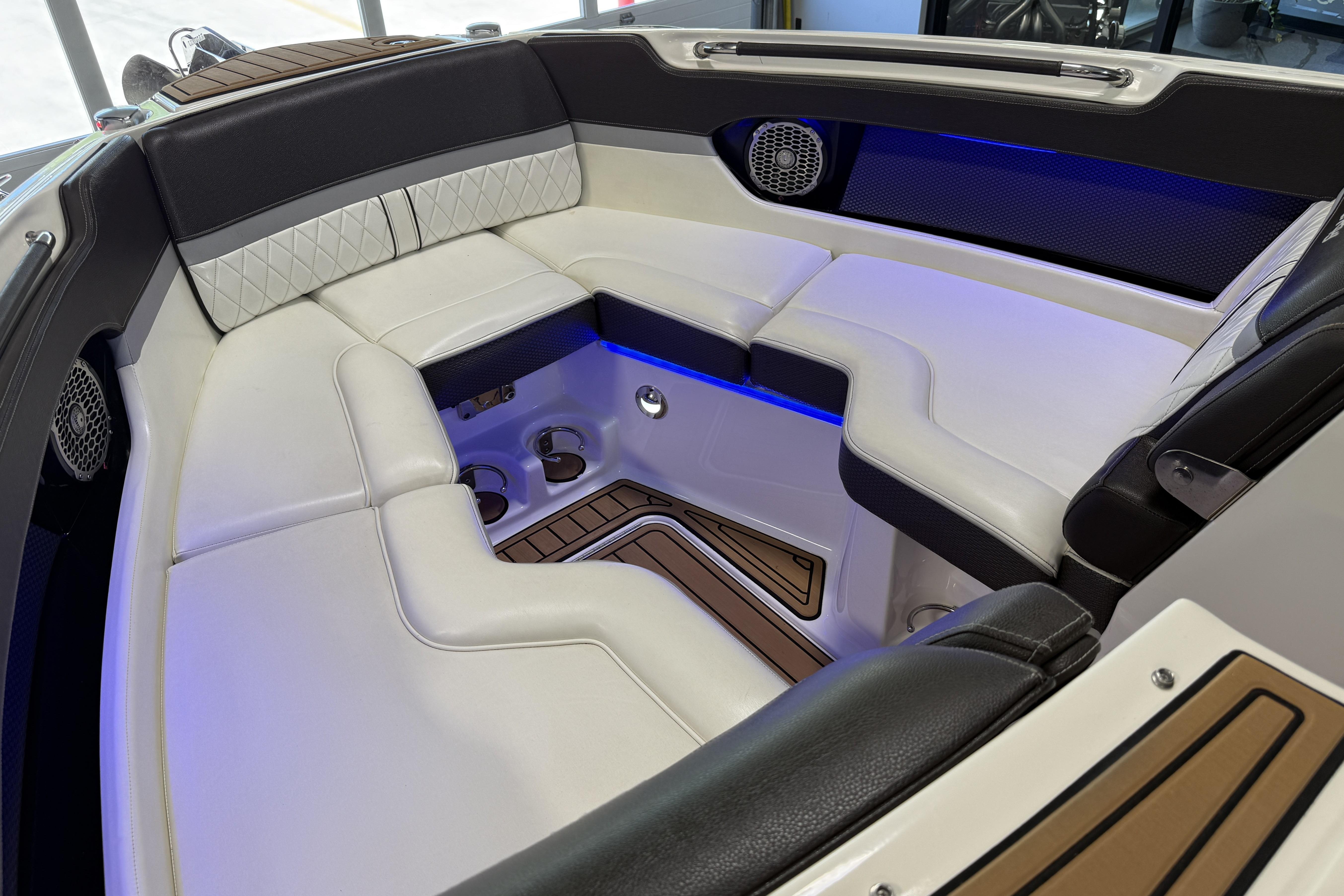Luxurious interior of 2017 Sea Ray SLX 280 boat with elegant seating and ambient lighting.