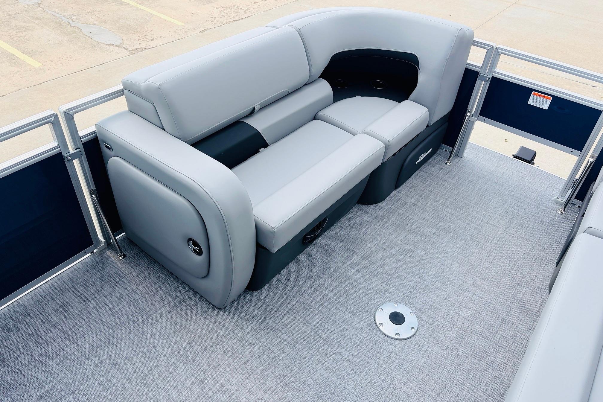 2026 Sun Tracker SportFish 22 DLX pontoon boat with sleek gray seating and spacious deck.